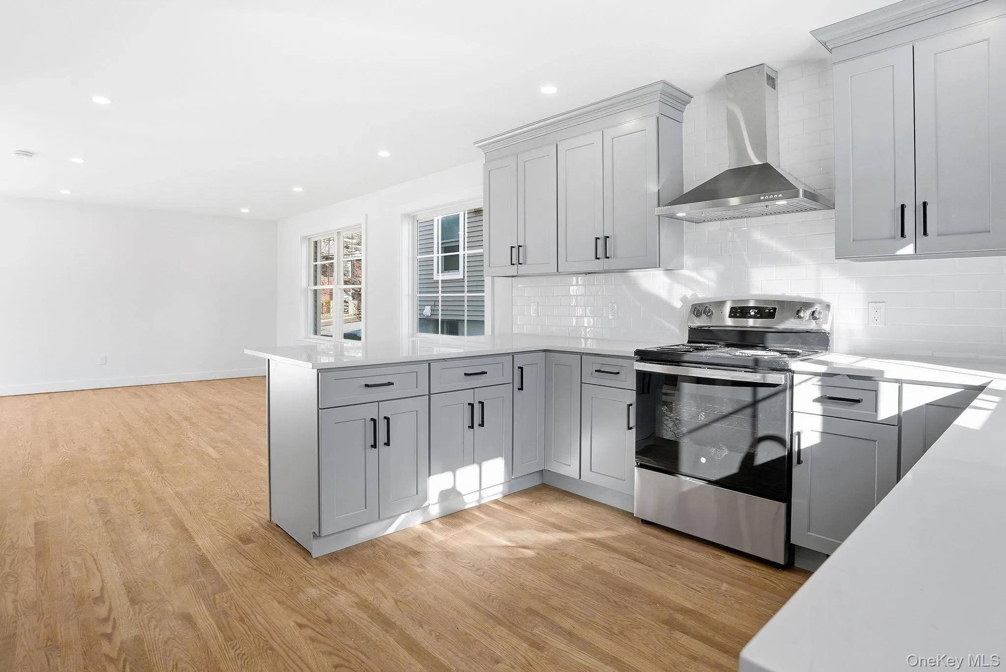 New kitchen with gray shaker cabinetry and quartz countertops, ready for your culinary adventures. New kitchen with gray shaker cabinetry and quartz countertops, ready for your culinary adventures.