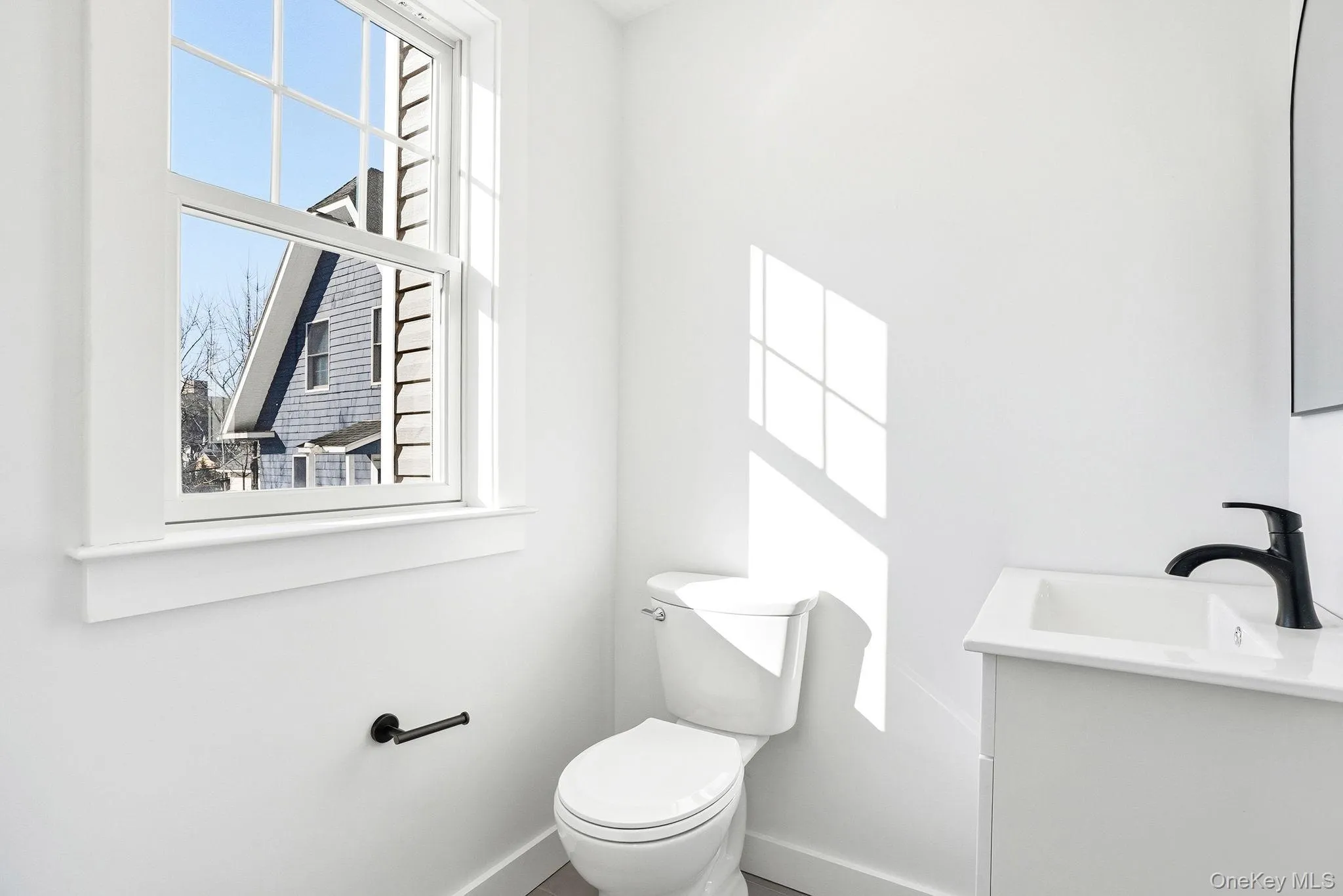 Powder room conveniently situated off the kitchen, perfect for guests. Powder room conveniently situated off the kitchen, perfect for guests.