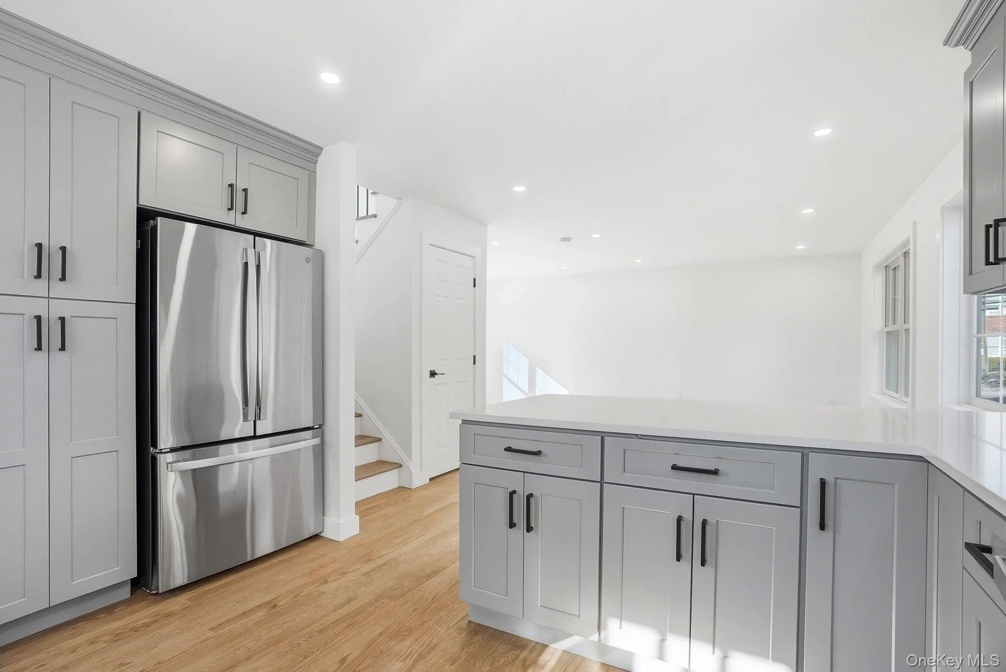 This brand new kitchen showcases gray shaker cabinetry and quartz countertops, offering a modern, sophisticated space for everyday living. This brand new kitchen showcases gray shaker cabinetry and quartz countertops, offering a modern, sophisticated space for everyday living.