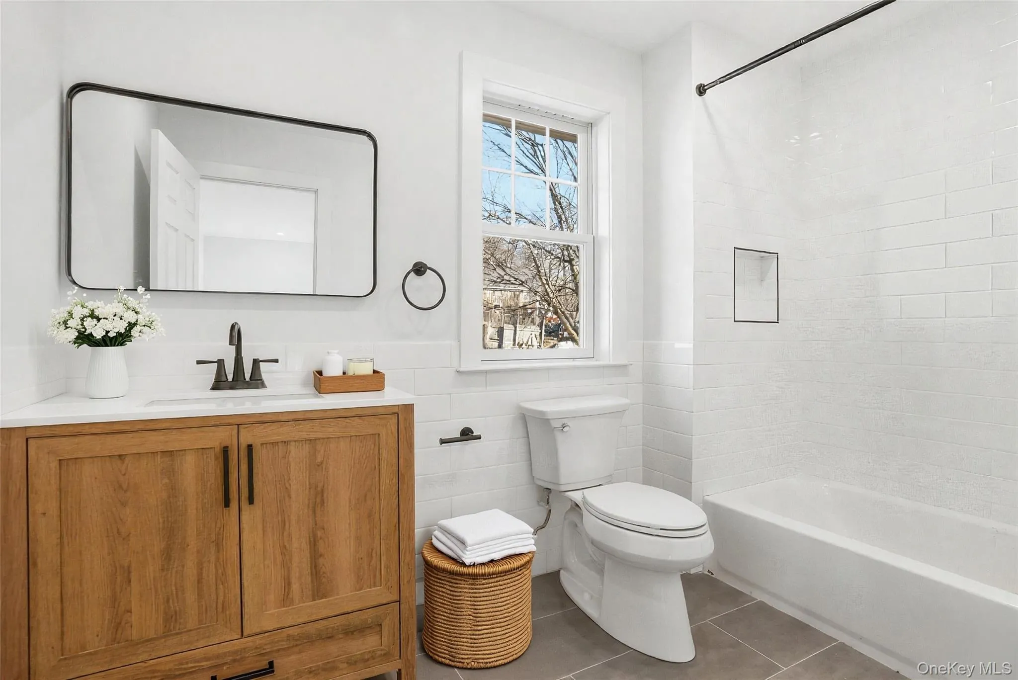 Hall bathroom conveniently located and updated with new, polished fixtures and finishes. Hall bathroom conveniently located and updated with new, polished fixtures and finishes.