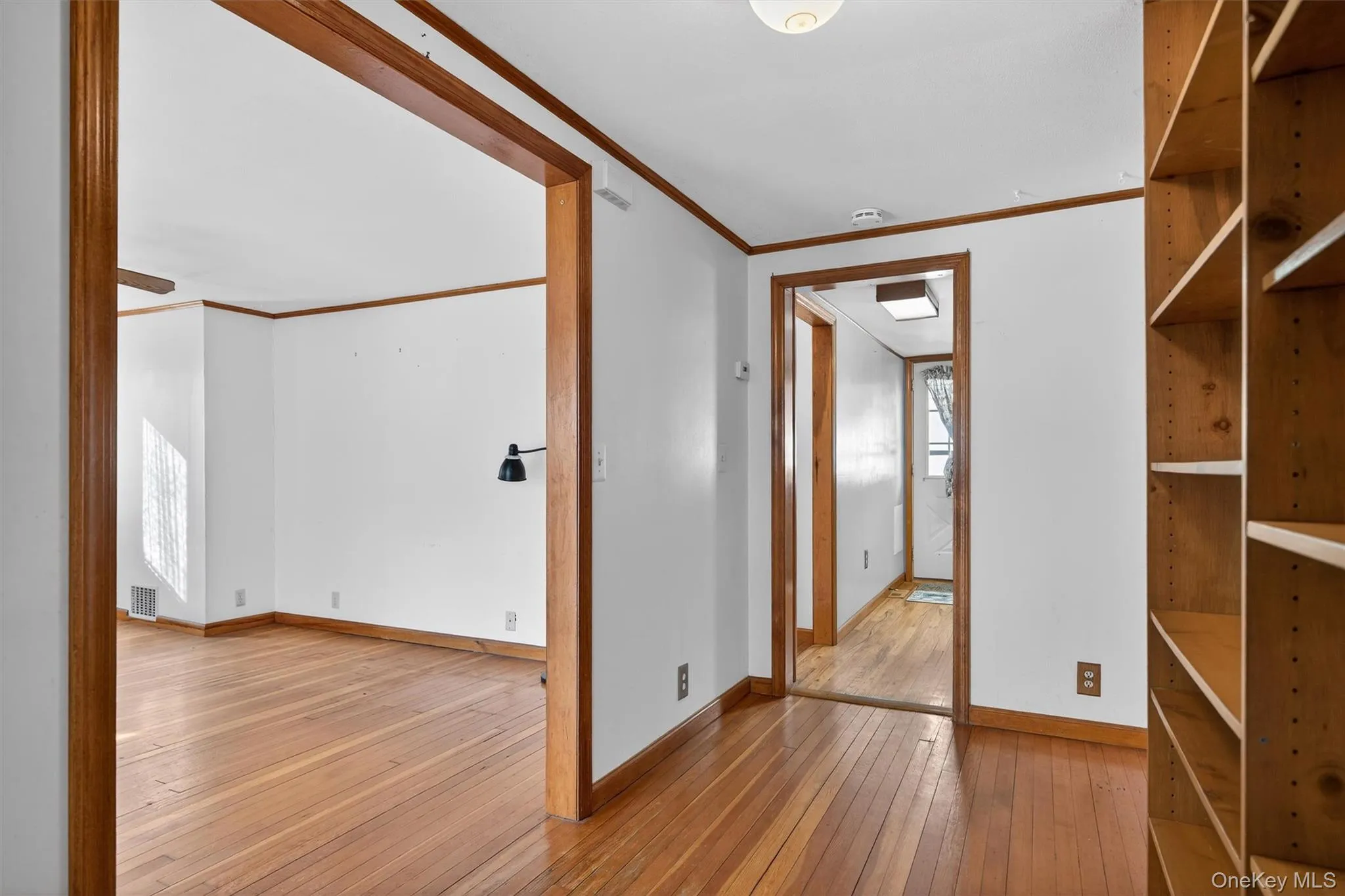 Hallway leading to living room and bedroom Hallway leading to living room and bedroom