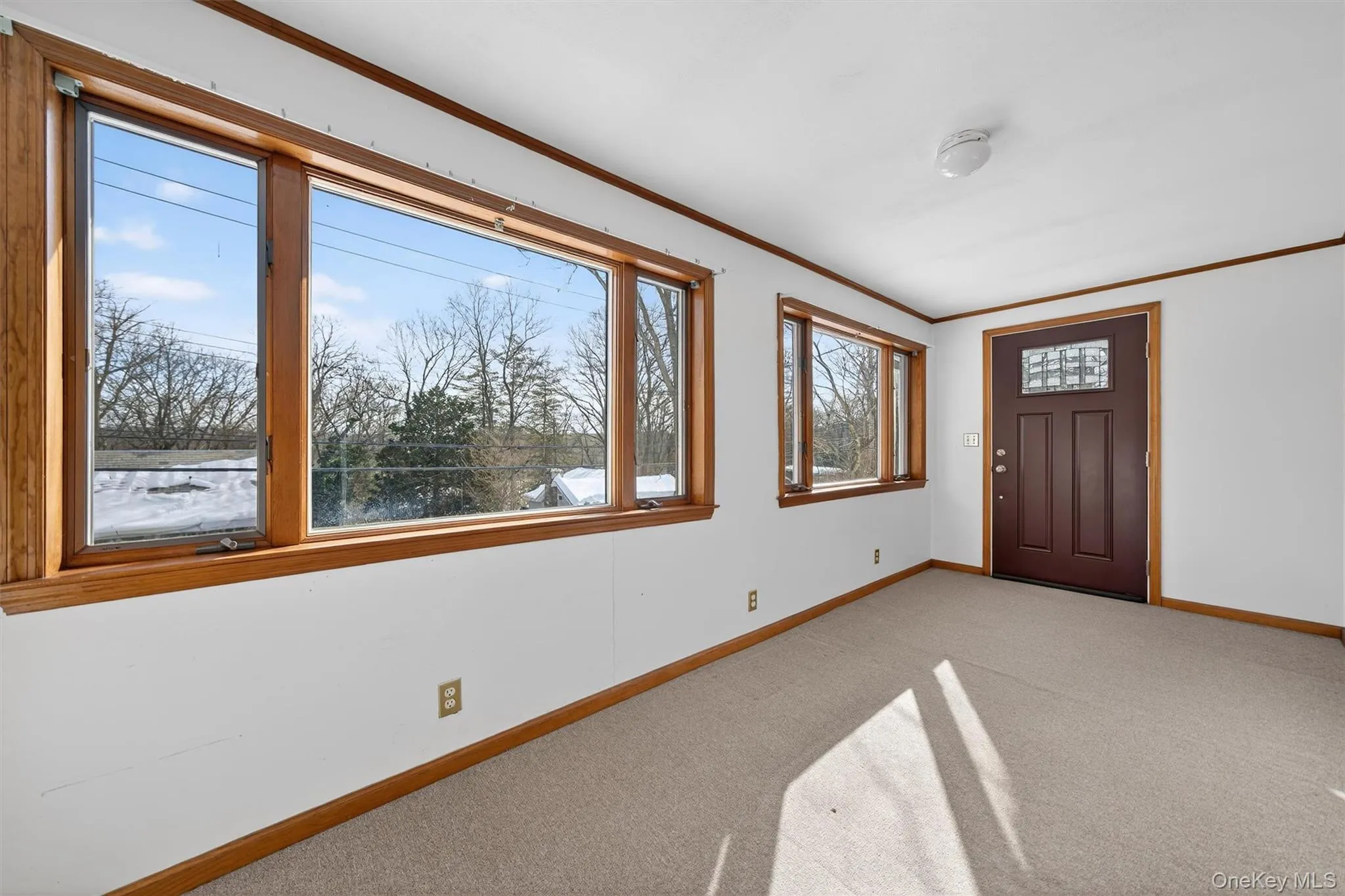 Bright sun room with seasonal lake views Bright sun room with seasonal lake views