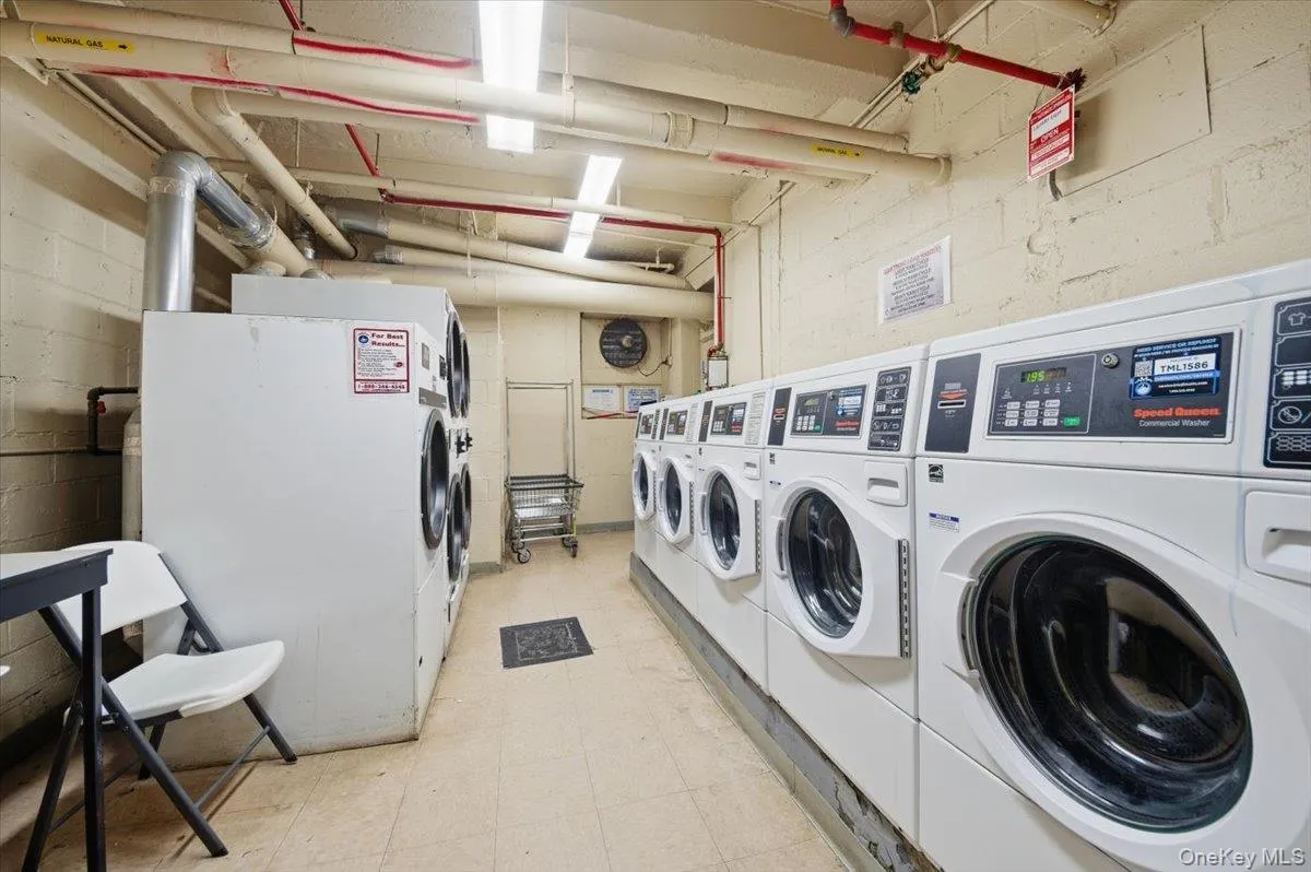 Shared laundry with washing machine and clothes dryer Shared laundry with washing machine and clothes dryer
