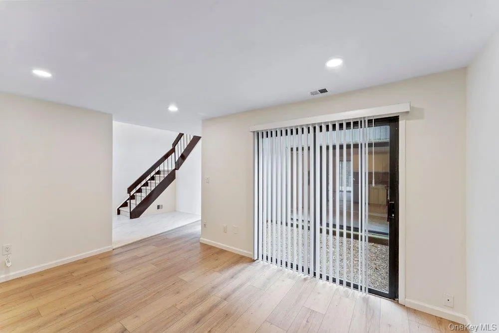 Unfurnished room with recessed lighting and light wood finished floors Unfurnished room with recessed lighting and light wood finished floors