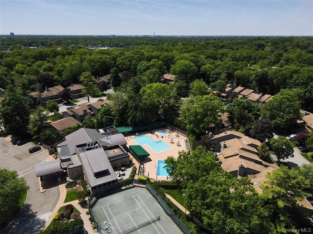 View of property location with a pool area and nearby suburban area View of property location with a pool area and nearby suburban area