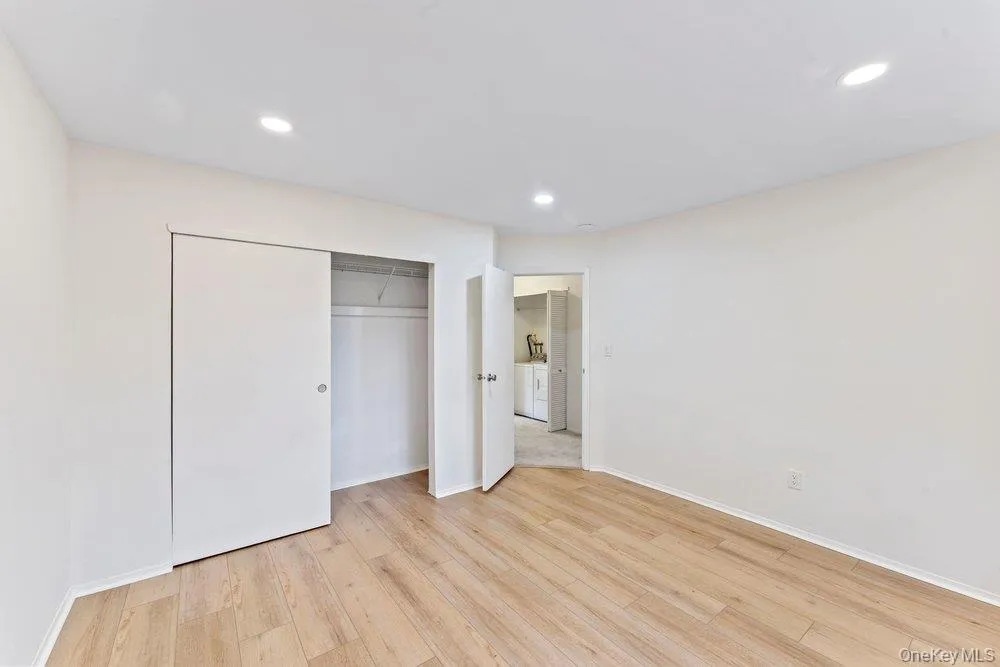 Unfurnished bedroom featuring light wood-type flooring, recessed lighting, and a closet Unfurnished bedroom featuring light wood-type flooring, recessed lighting, and a closet