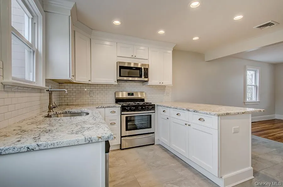 Granite counter tops with Shaker cabinets and stainless steal appliances Granite counter tops with Shaker cabinets and stainless steal appliances