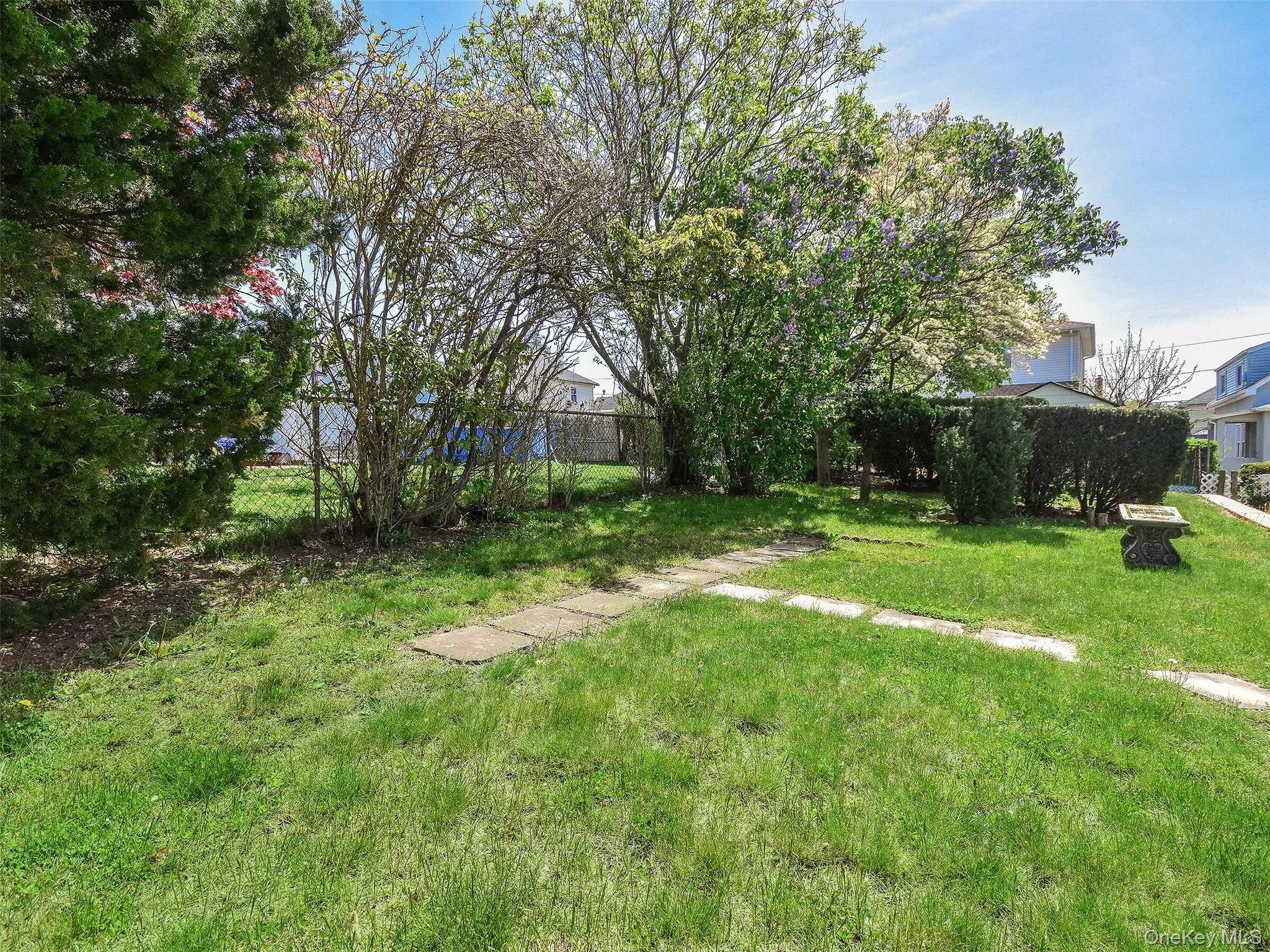 Grassy yard area to the side Grassy yard area to the side