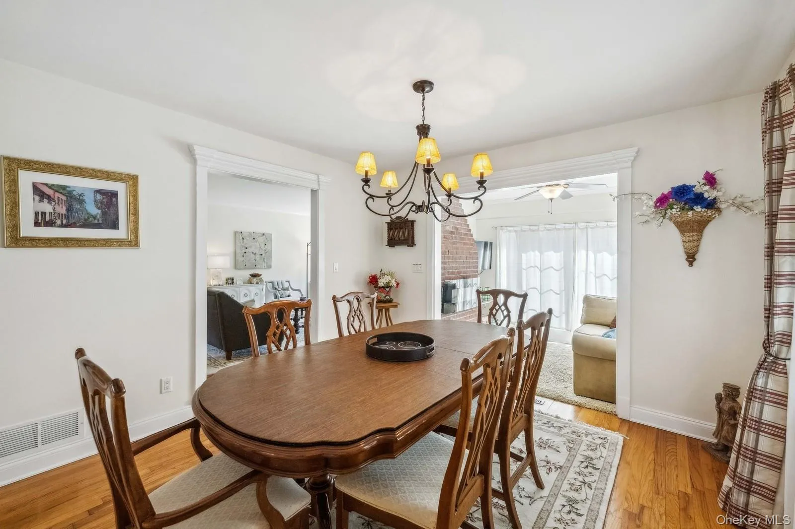Dining room with hardwood floor. View of Den. Dining room with hardwood floor. View of Den.