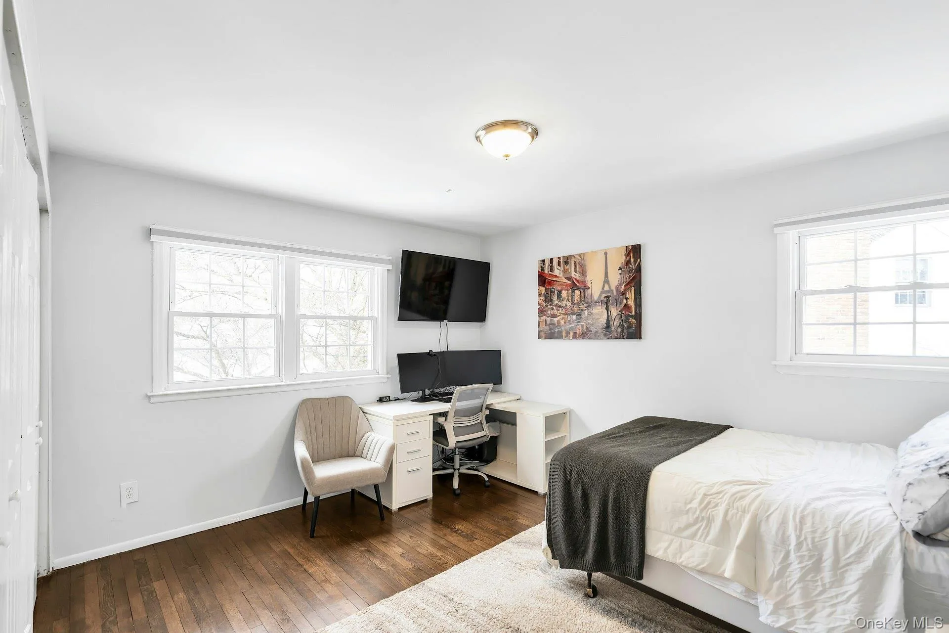 Bedroom featuring dark wood-style floors Bedroom featuring dark wood-style floors