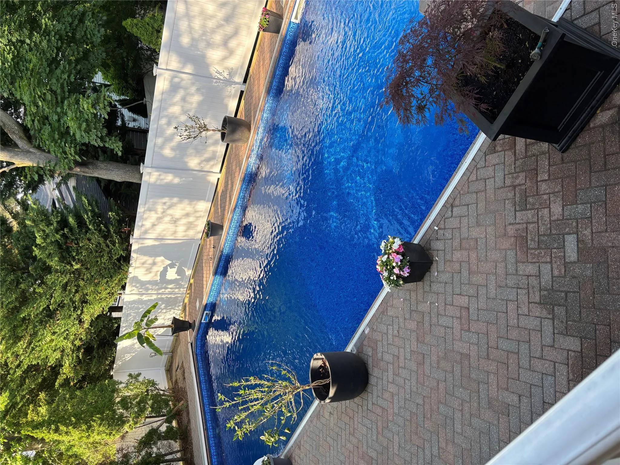 Rectangular in-ground pool with new pool liner, cover, fence, landscaping 5/2026 Rectangular in-ground pool with new pool liner, cover, fence, landscaping 5/2026