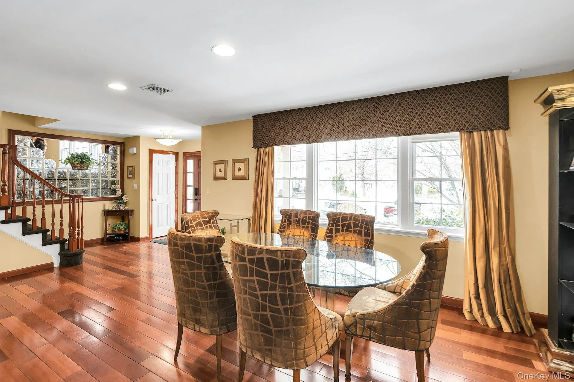 Dining space with hardwood / wood-style flooring and recessed lighting Dining space with hardwood / wood-style flooring and recessed lighting