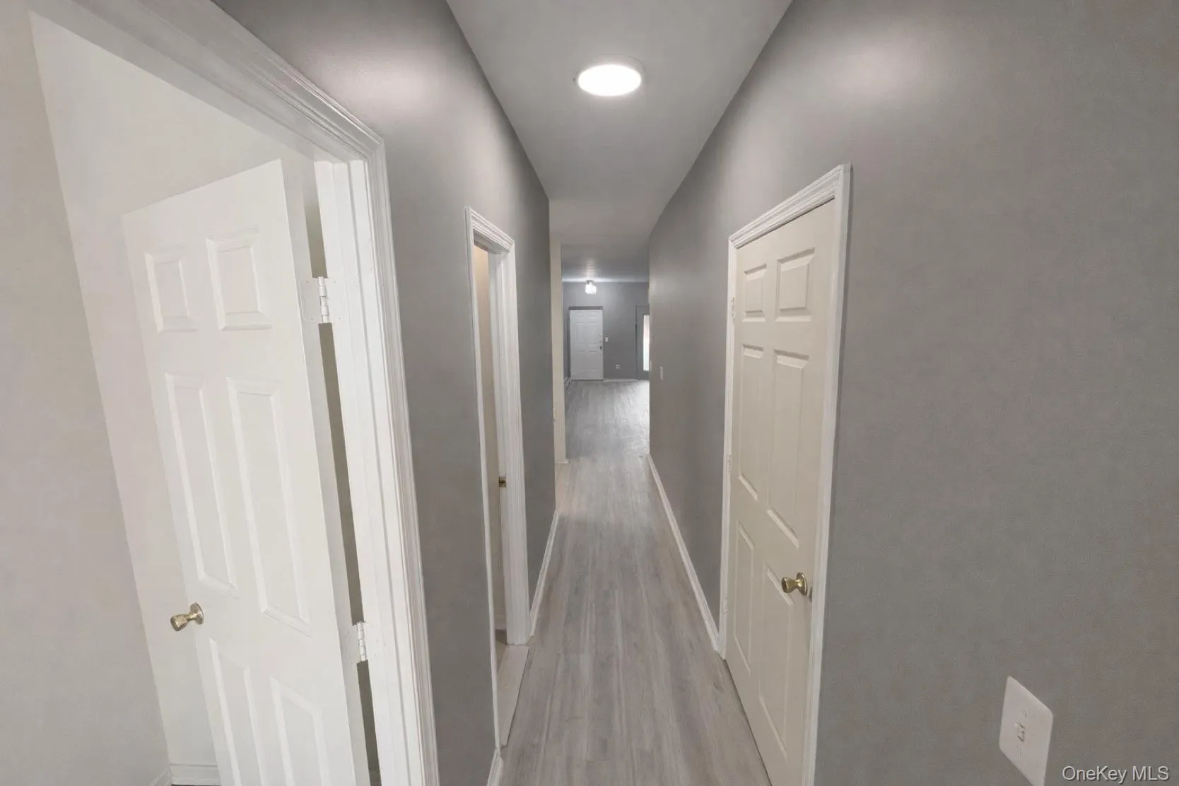 Well-maintained interior hallway providing access to apartment units in secure building. Well-maintained interior hallway providing access to apartment units in secure building.