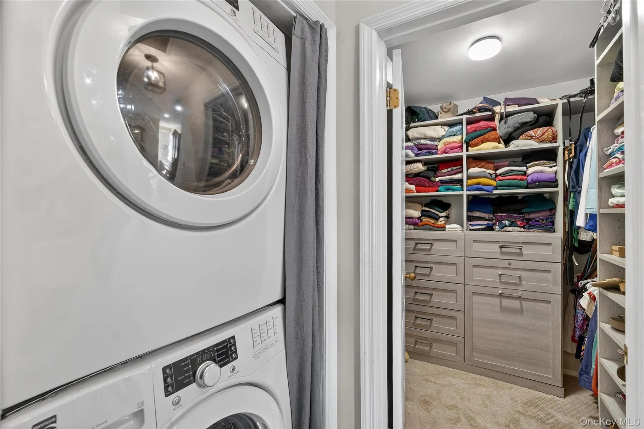 Laundry and view of Walk-in Closet with built-in cabinets. Laundry and view of Walk-in Closet with built-in cabinets.
