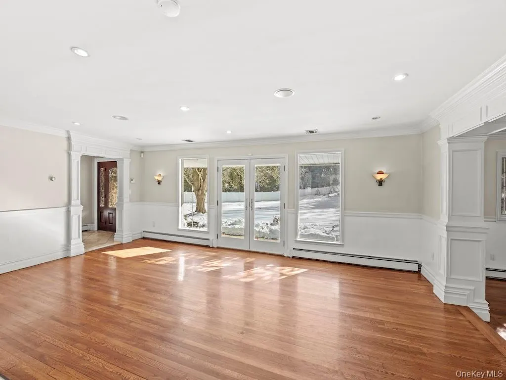 The living room features a French door that opens onto the front garden. The living room features a French door that opens onto the front garden.