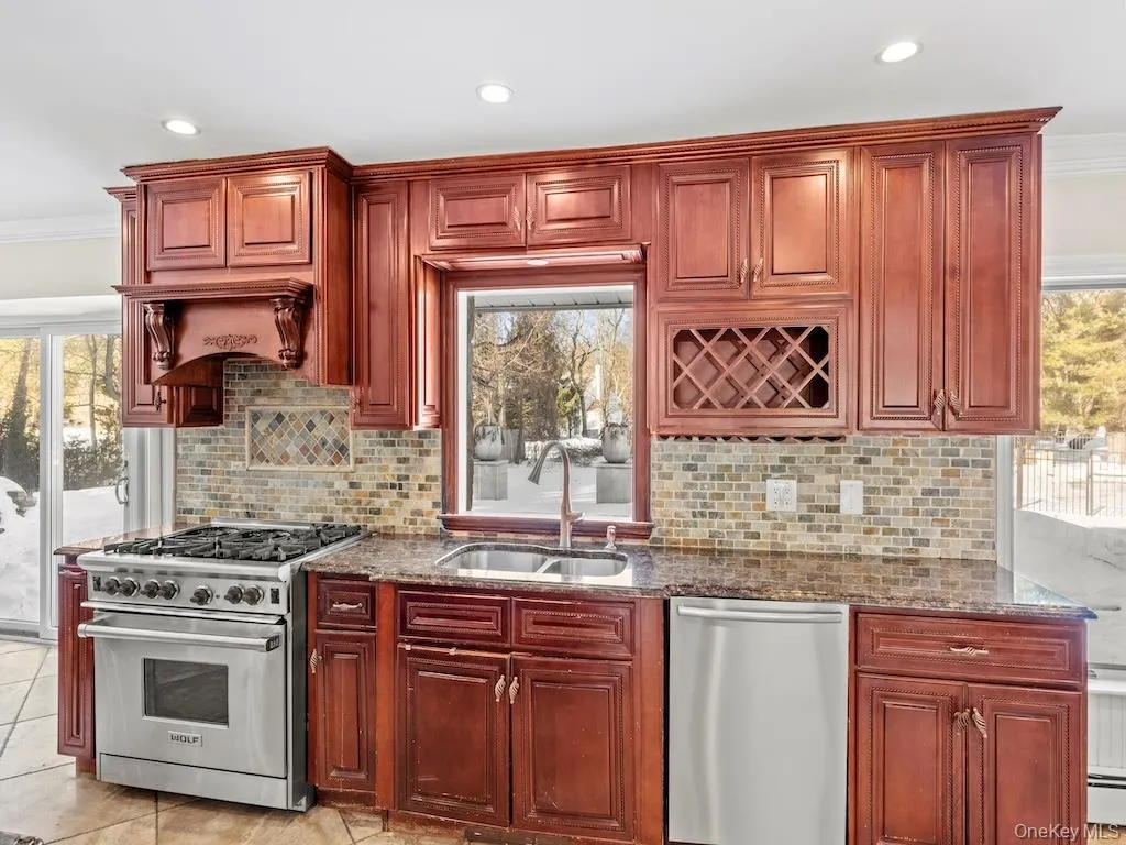 Custom-built cabinets with designers cabinets, stainless steel appliances Custom-built cabinets with designers cabinets, stainless steel appliances