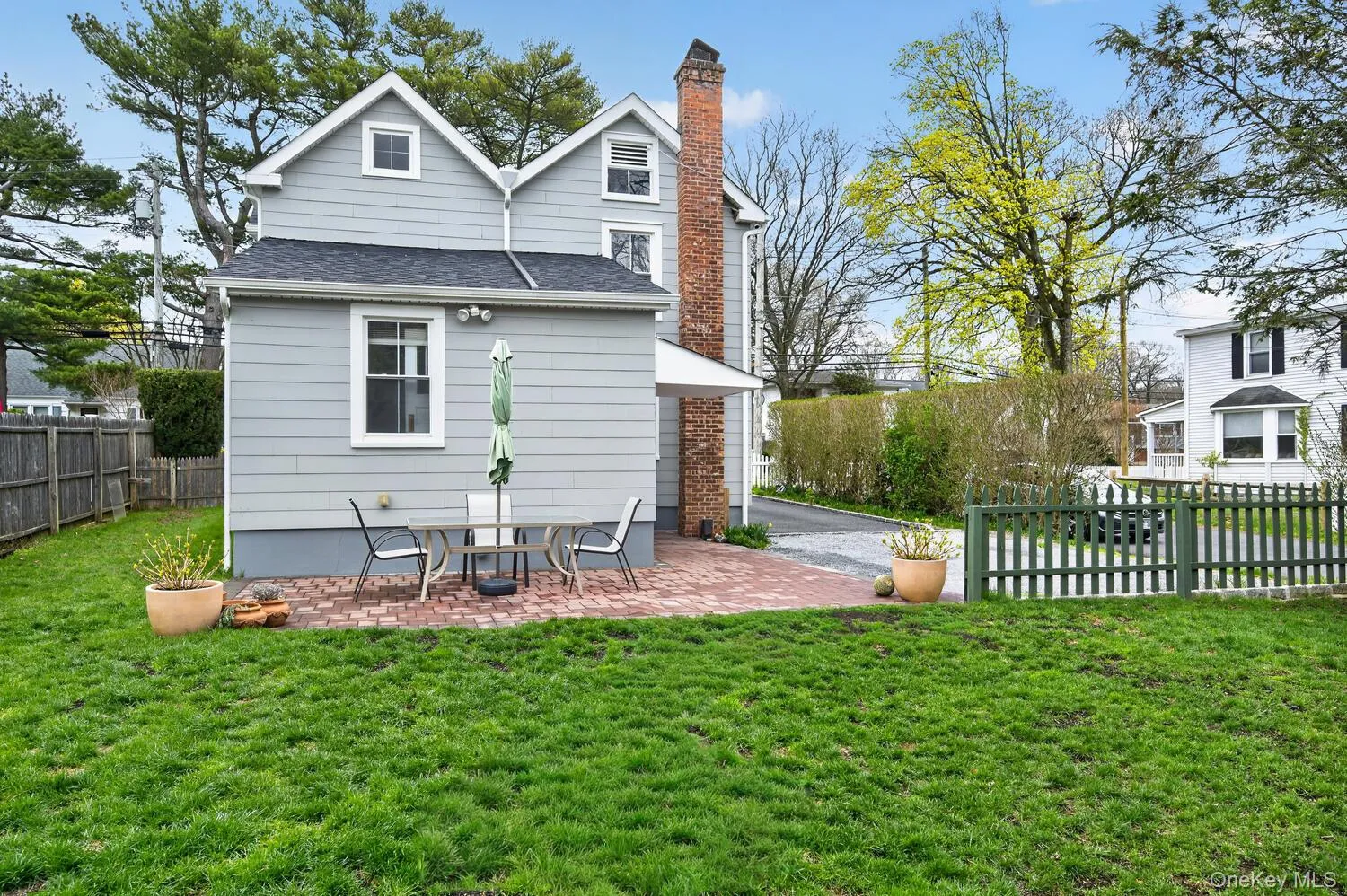 Backyard with a brick terrace. Backyard with a brick terrace.