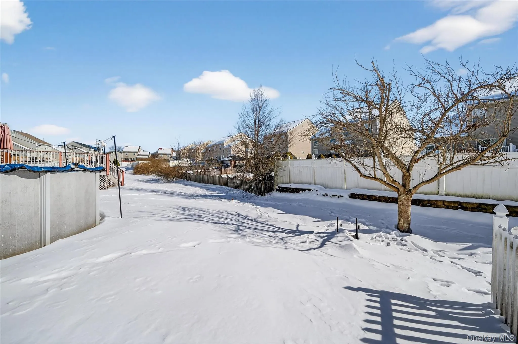 Yard covered in snow featuring a residential view Yard covered in snow featuring a residential view