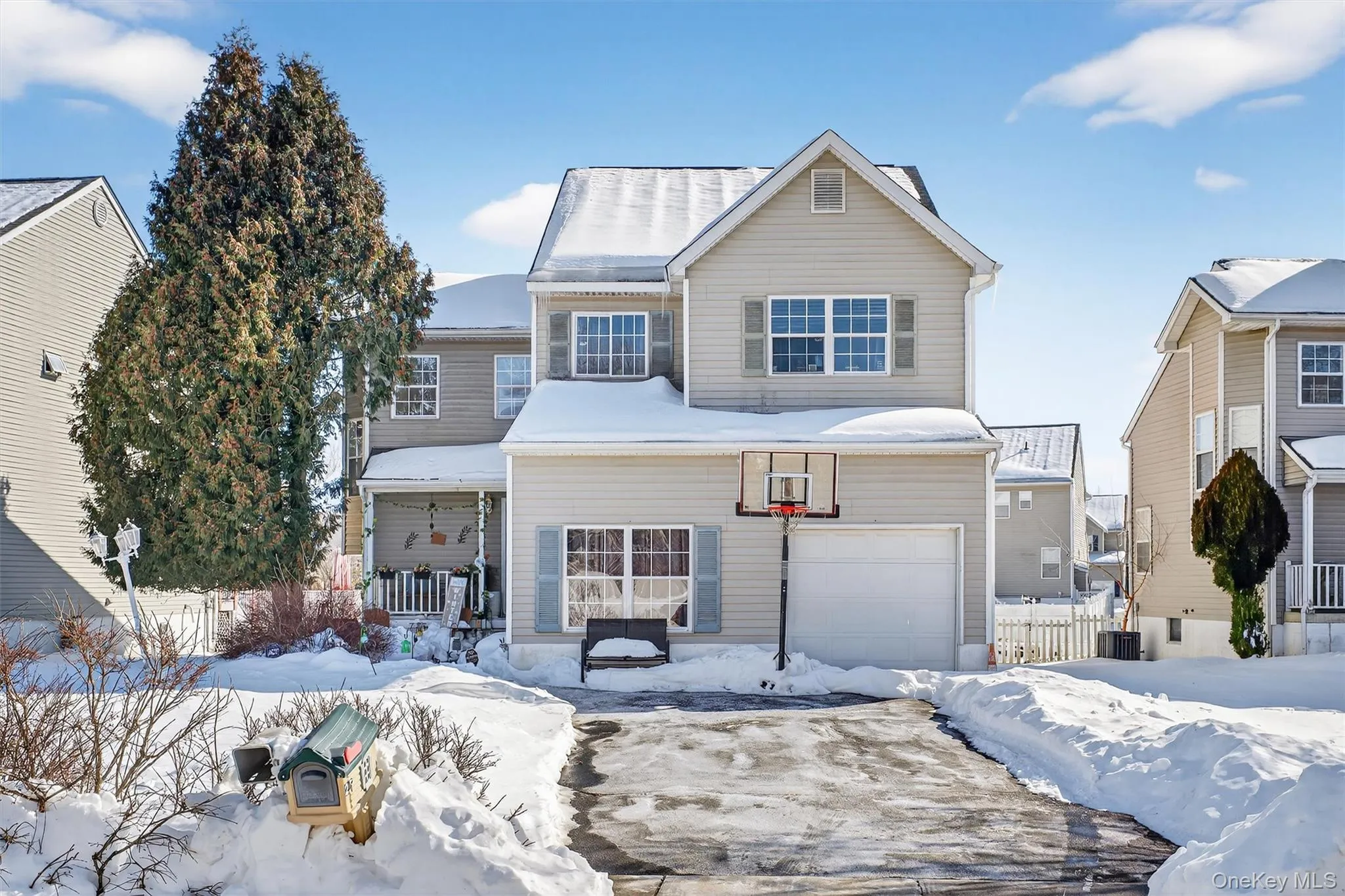 Traditional-style house featuring a garage Traditional-style house featuring a garage