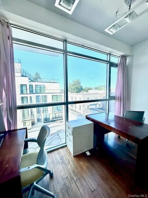 Home office with dark wood-type flooring Home office with dark wood-type flooring