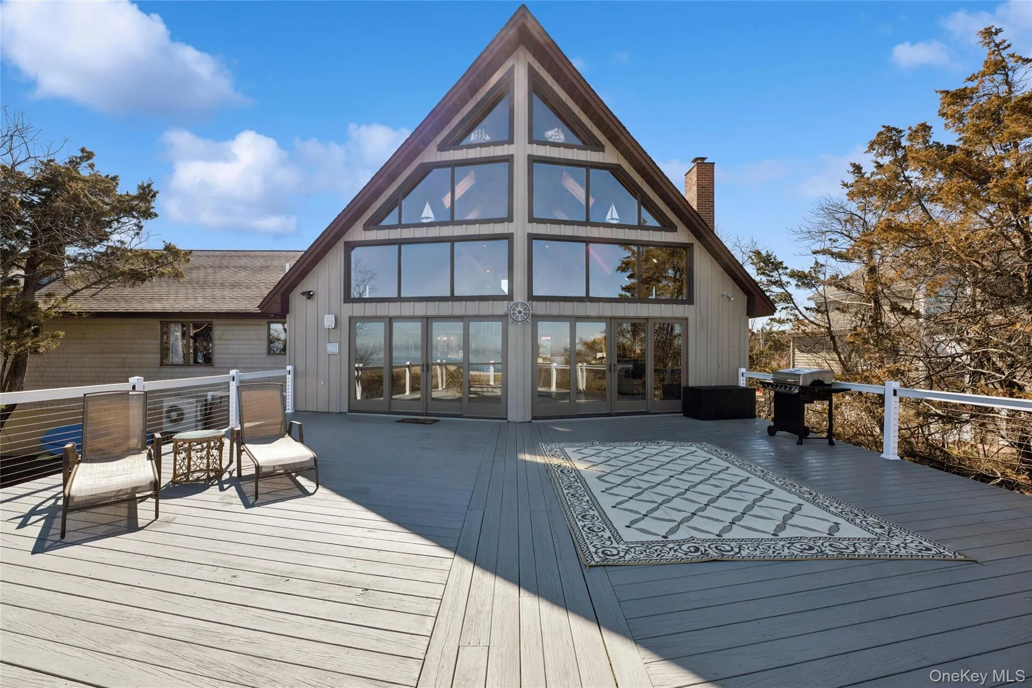 Front of home faces onto a 40'x45' deck overlooking the Long Island Sound Front of home faces onto a 40'x45' deck overlooking the Long Island Sound