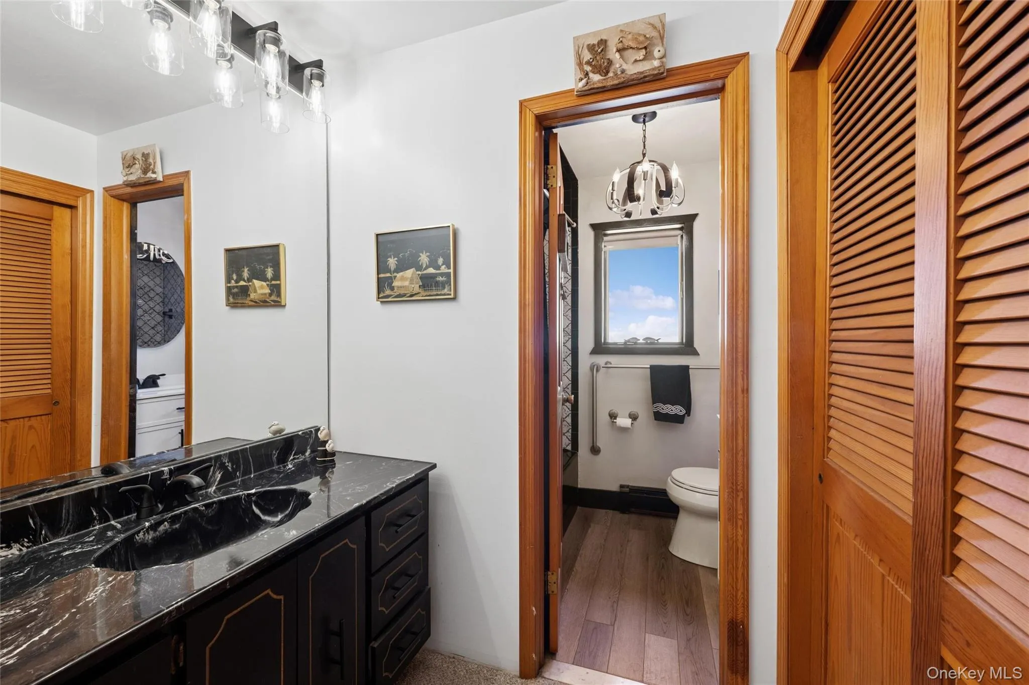main floor hall dressing area, double laundry closet, sink, vanity. door for privacy in shower & toilet main floor hall dressing area, double laundry closet, sink, vanity. door for privacy in shower & toilet