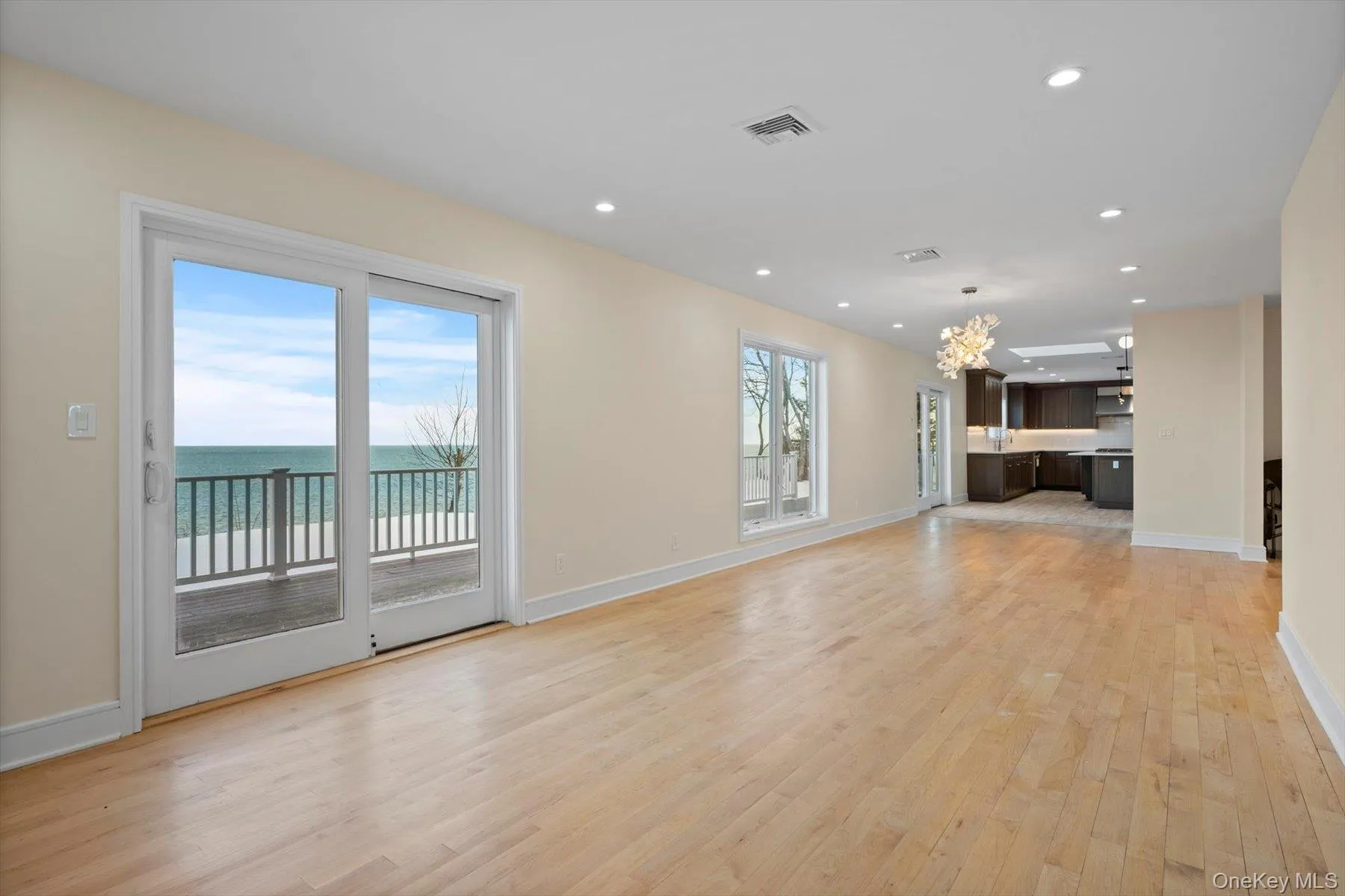 Large Dining Room with sliders to rear deck and stunning waterviews Large Dining Room with sliders to rear deck and stunning waterviews