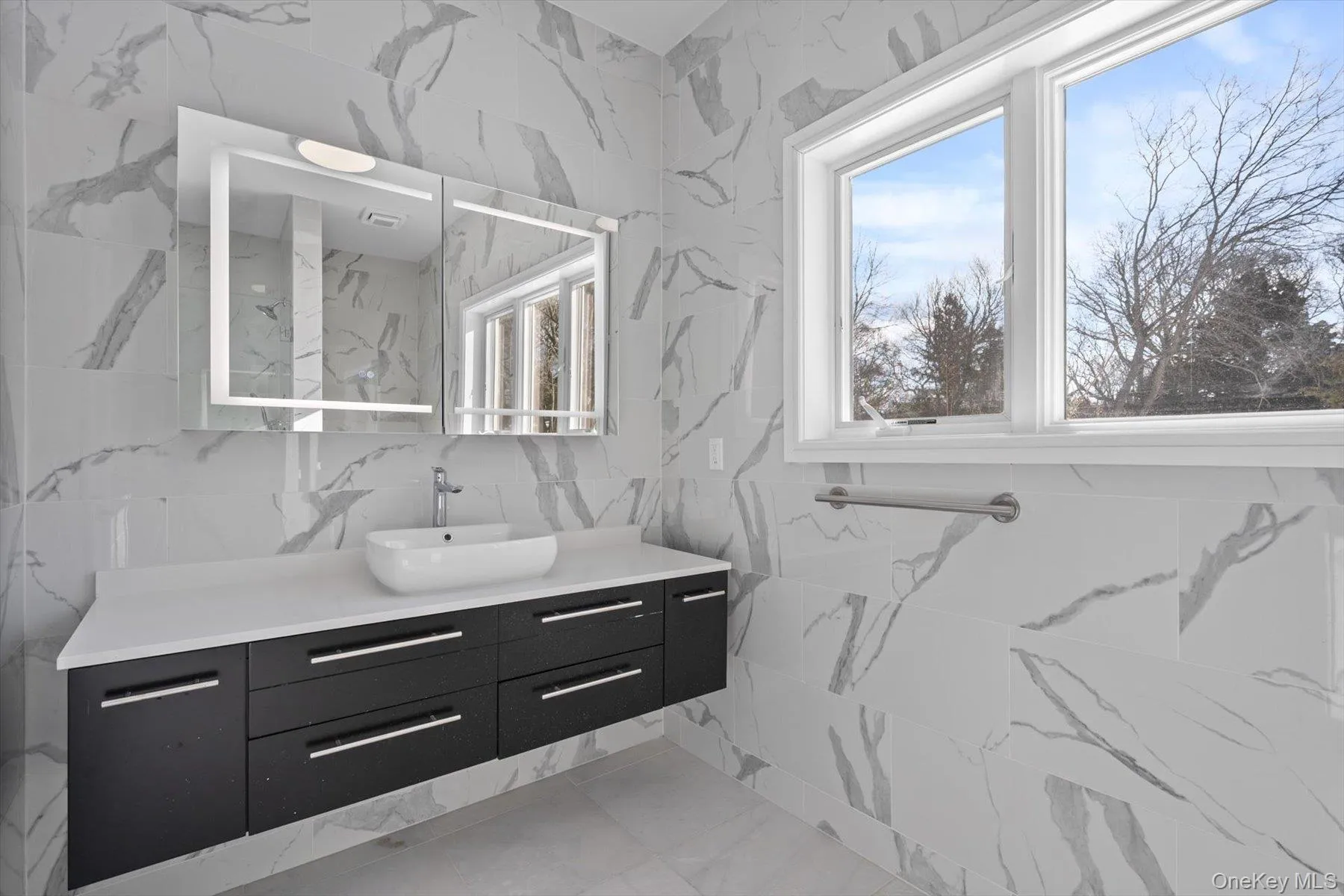 Floor to ceiling marble walls, top of the line fixtures Floor to ceiling marble walls, top of the line fixtures