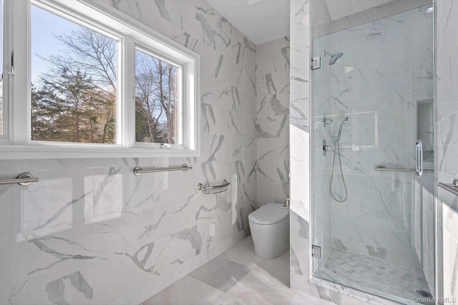 Primary bathroom with top of the line Moen heated self flushing bidet and double size walk in shower Primary bathroom with top of the line Moen heated self flushing bidet and double size walk in shower