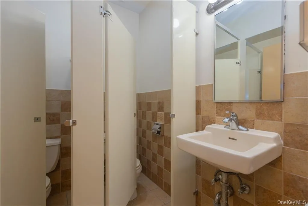 Rest room located off the hallway Rest room located off the hallway