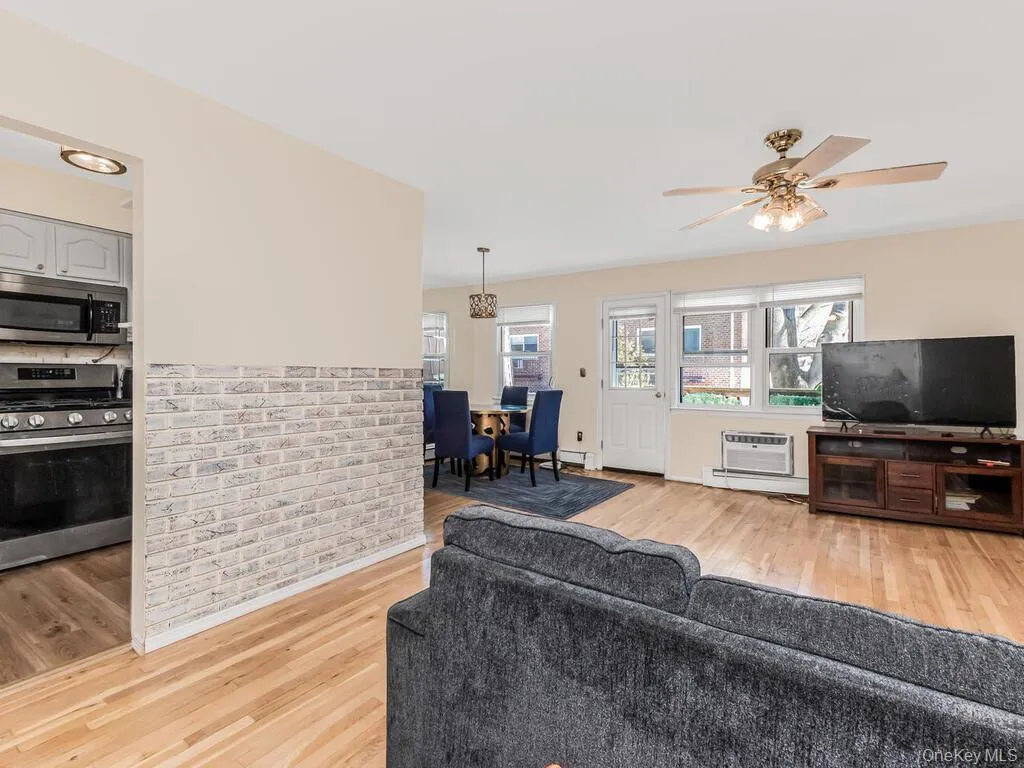 Entry view featuring the living room, dining room, and kitchen Entry view featuring the living room, dining room, and kitchen