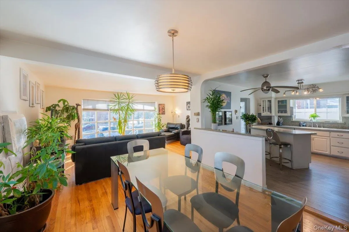 Dining space with light wood-style flooring and ceiling fan Dining space with light wood-style flooring and ceiling fan