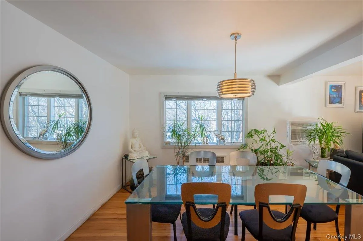 Dining room with plenty of natural light and light wood-style flooring Dining room with plenty of natural light and light wood-style flooring