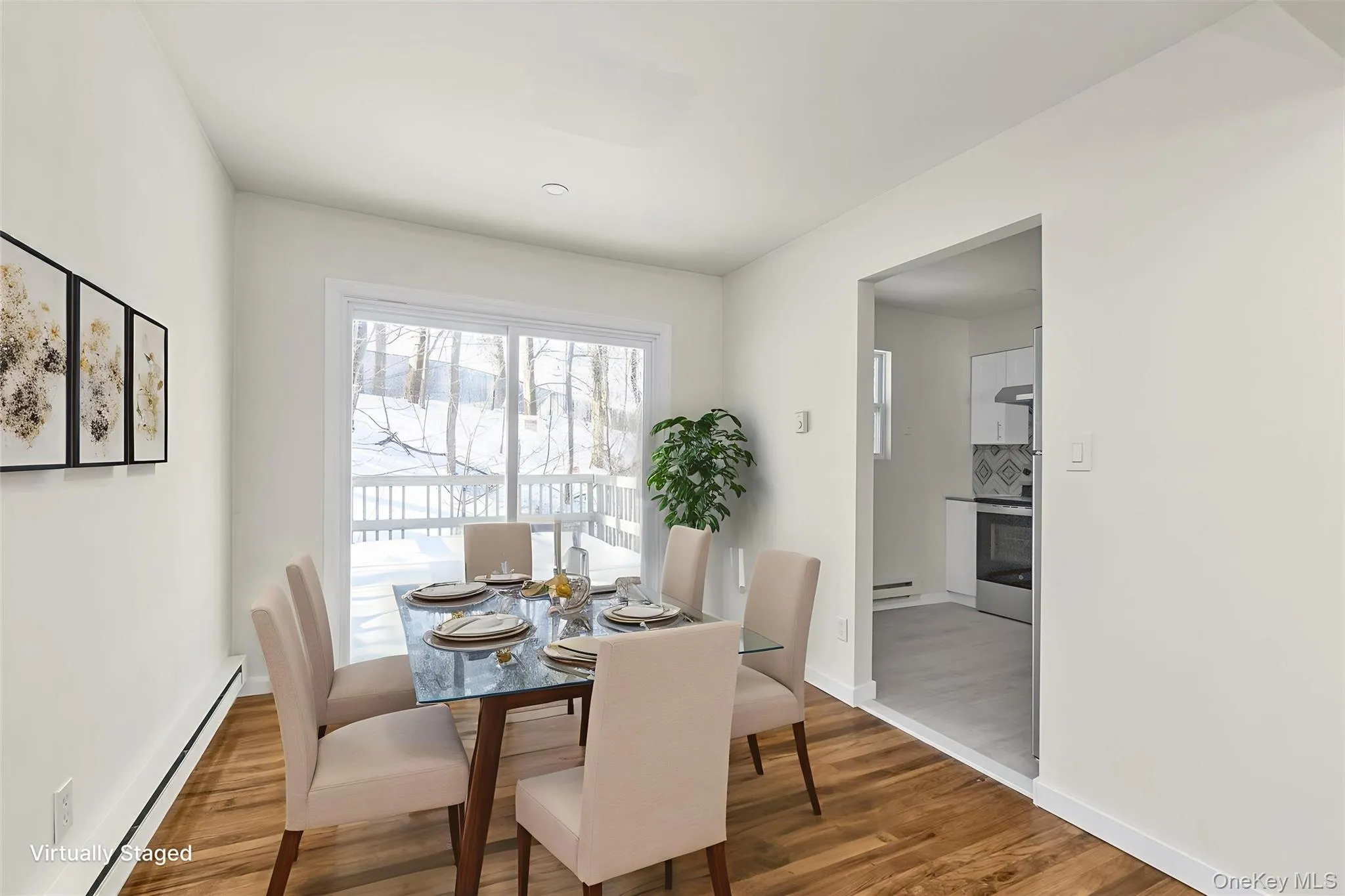 Upstairs dining room with sliders to back deck. Upstairs dining room with sliders to back deck.