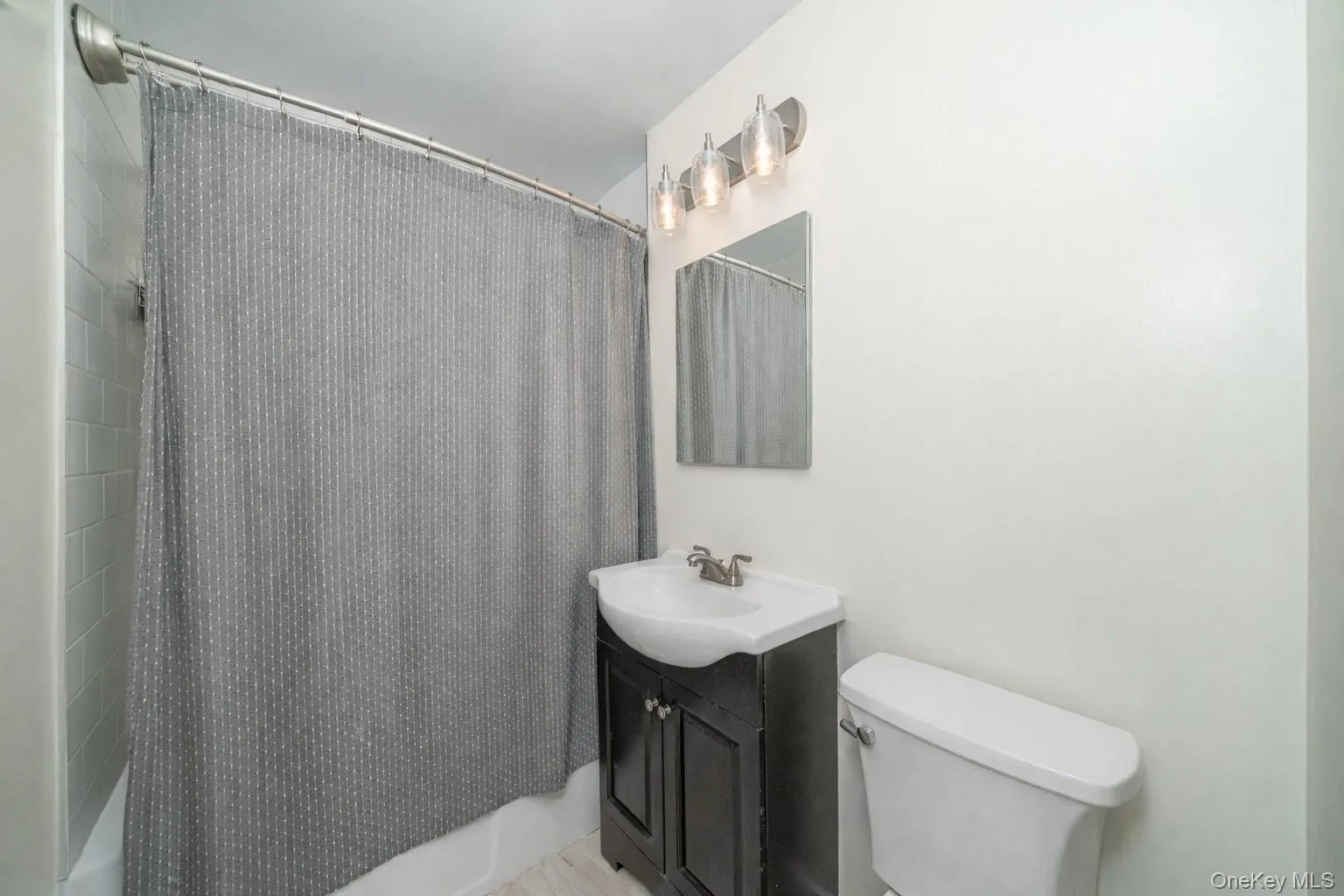 Updated bath with modern fixtures. Updated bath with modern fixtures.