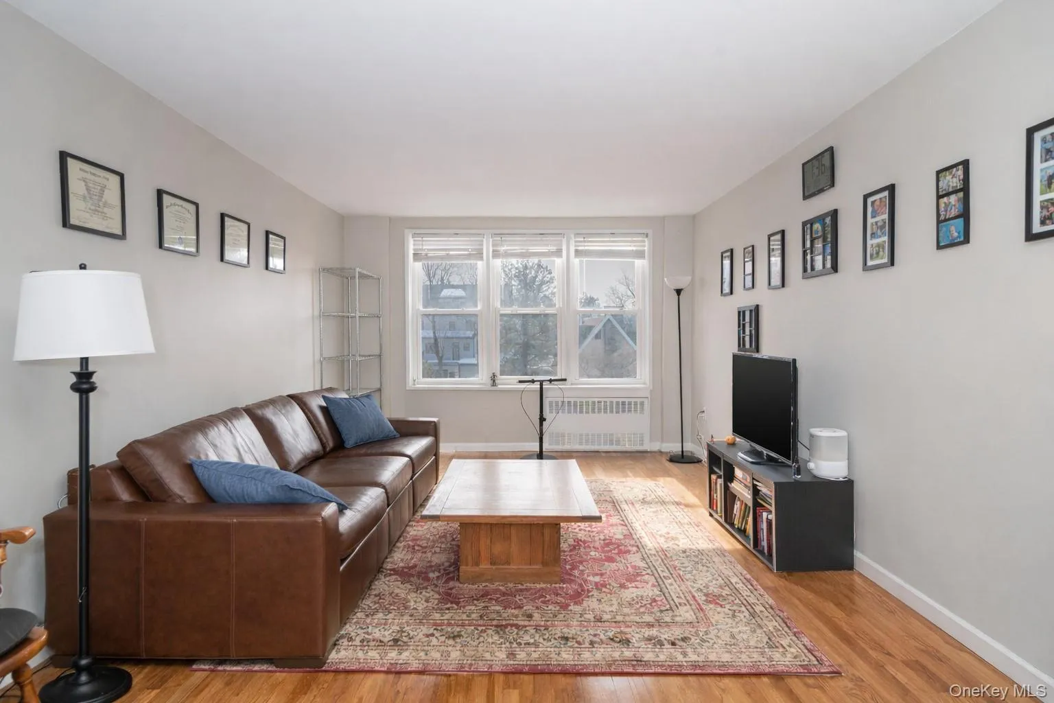 Bright and Sunny Living Room with hard wood floors.Photo has been digitally altered. Bright and Sunny Living Room with hard wood floors.Photo has been digitally altered.