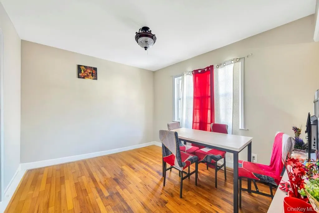 Dining room with baseboards and light wood-type flooring Dining room with baseboards and light wood-type flooring