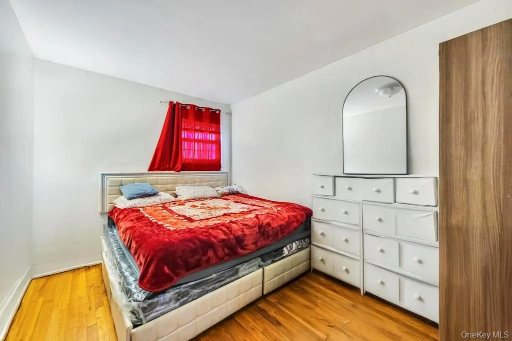 Bedroom with light wood-style floors and baseboards Bedroom with light wood-style floors and baseboards