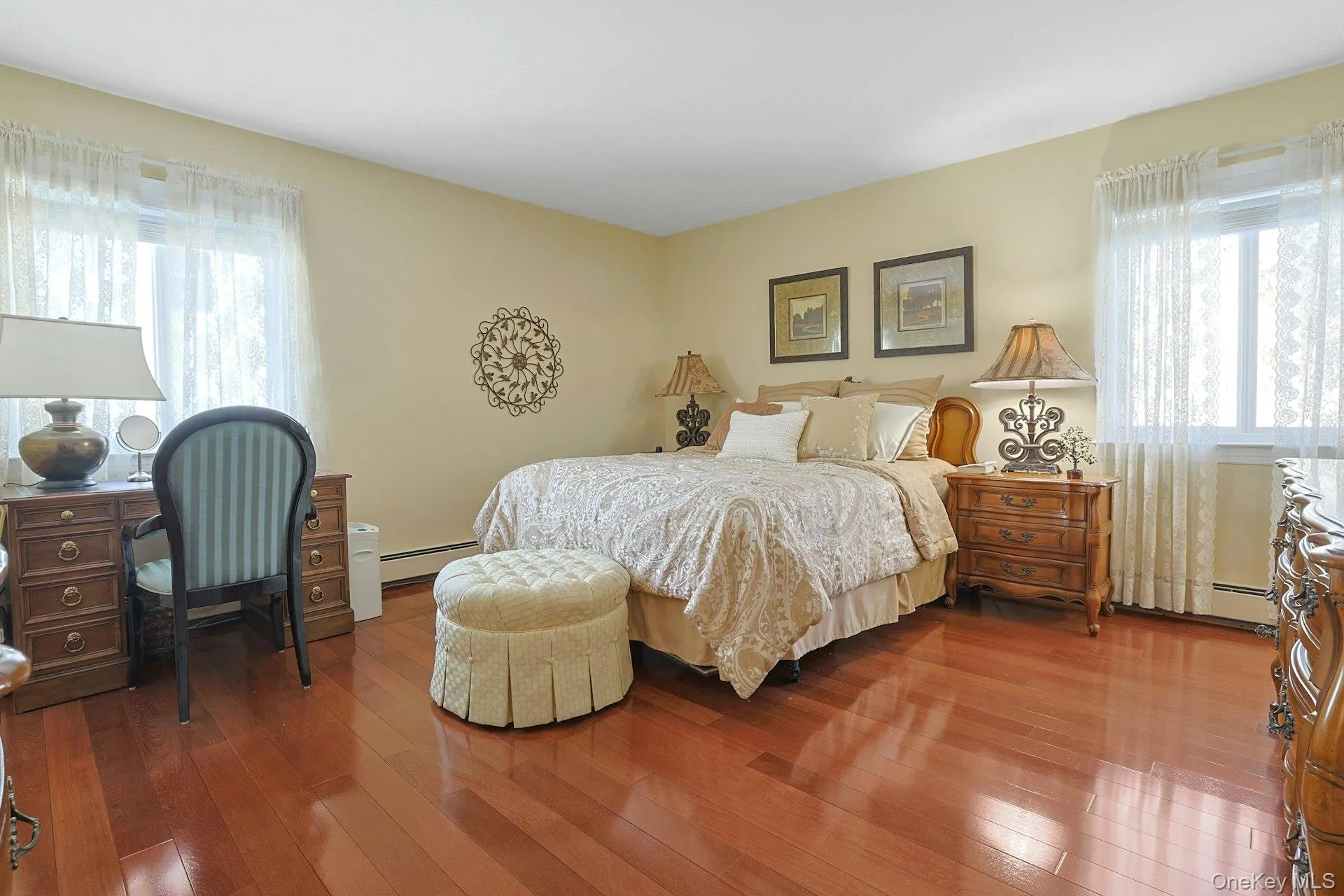 Generously Sized Primary Bedroom with Gorgeous Brazilian Rosewood Hardwood Floors Generously Sized Primary Bedroom with Gorgeous Brazilian Rosewood Hardwood Floors