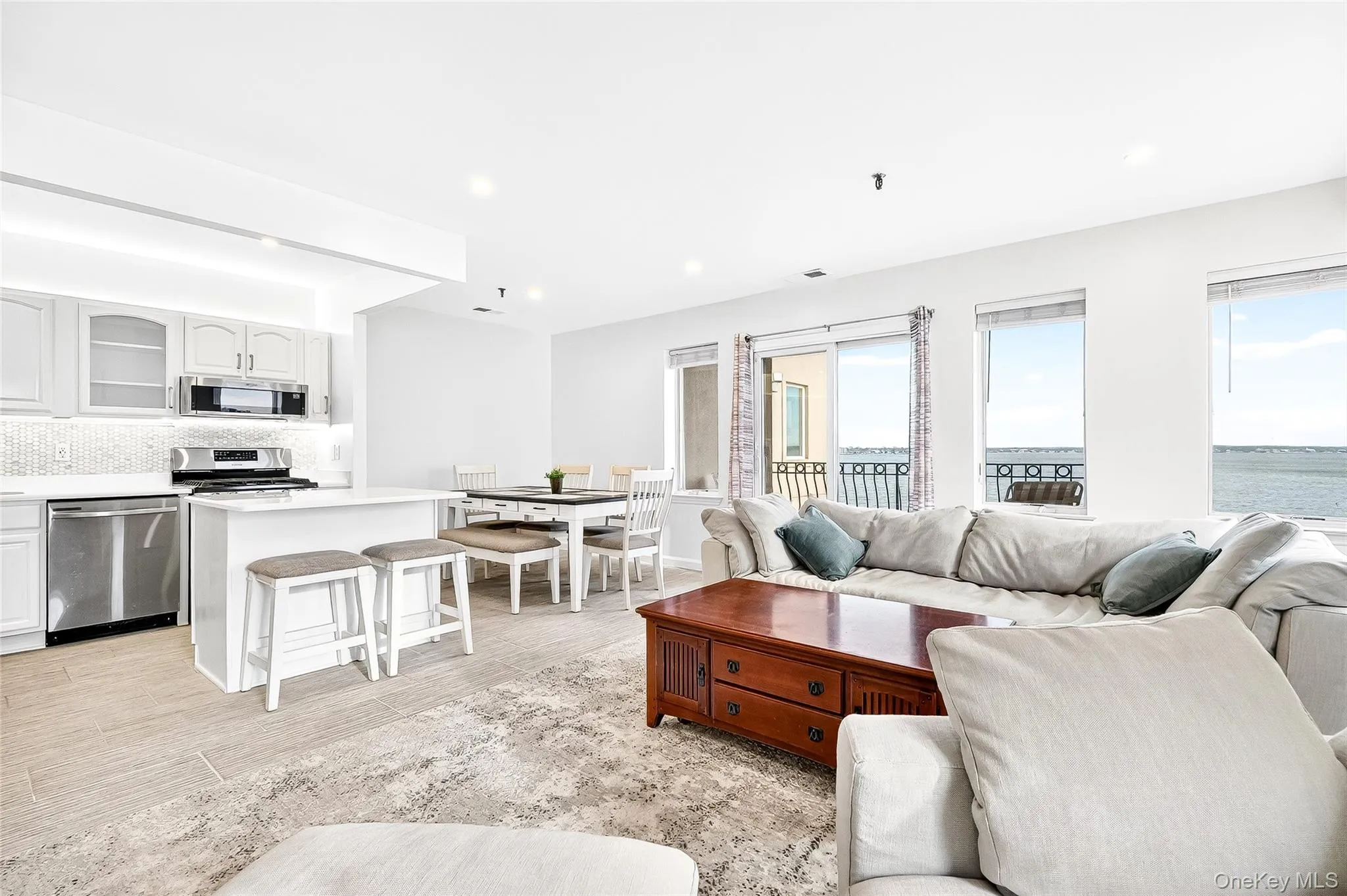 Living area featuring Italian marble flooring and recessed lighting Living area featuring Italian marble flooring and recessed lighting