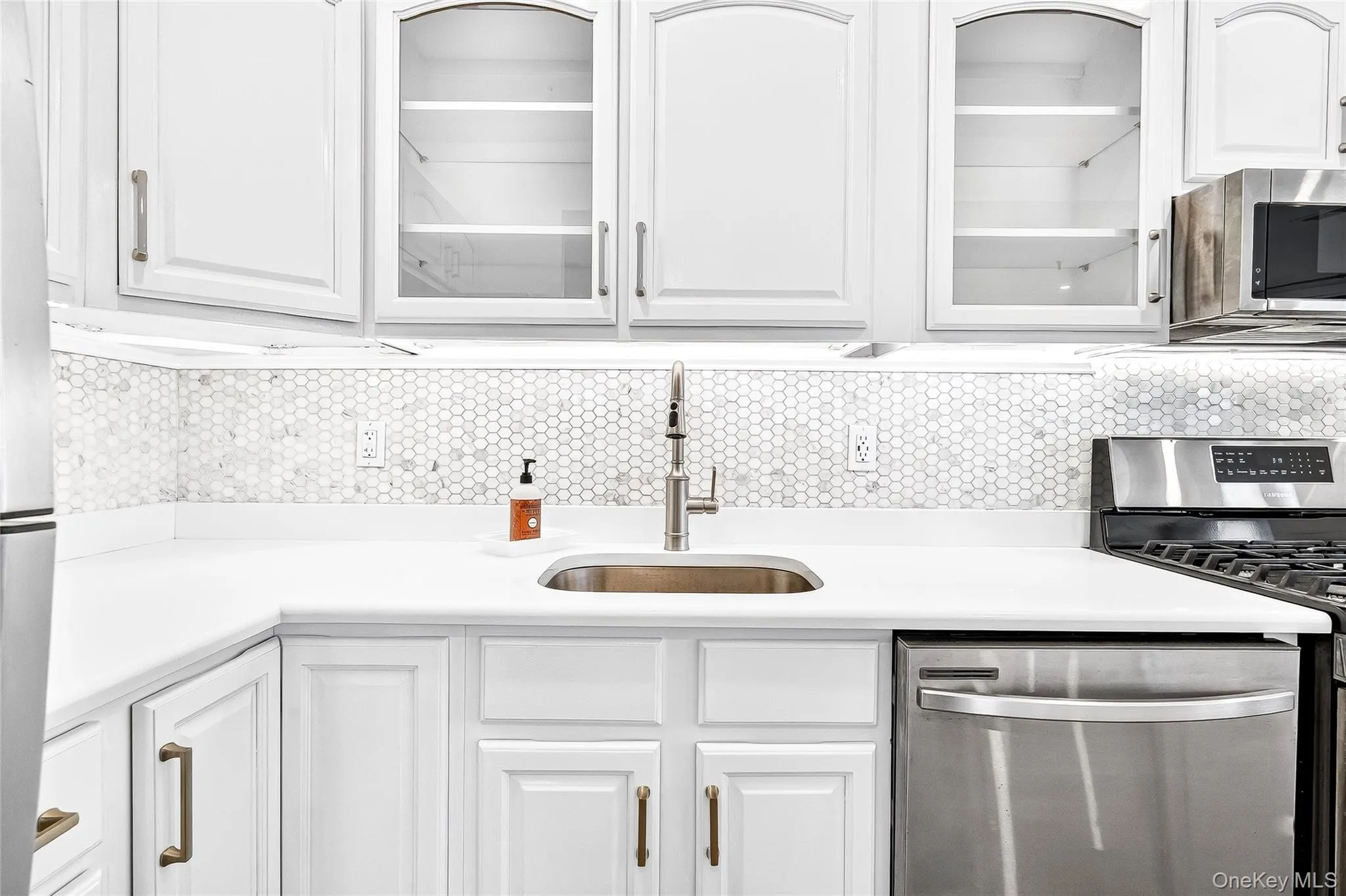 new quarts countertop, refinished cabinets. new quarts countertop, refinished cabinets.