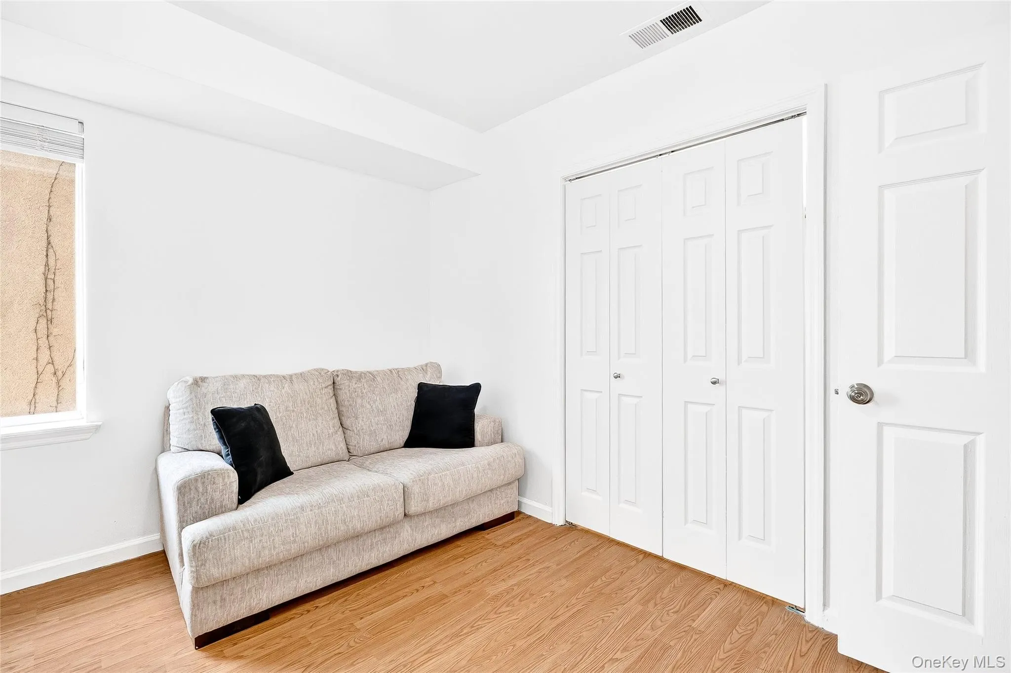 Third bedroom/office featuring wood finished flooring plenty of closet space. Third bedroom/office featuring wood finished flooring plenty of closet space.