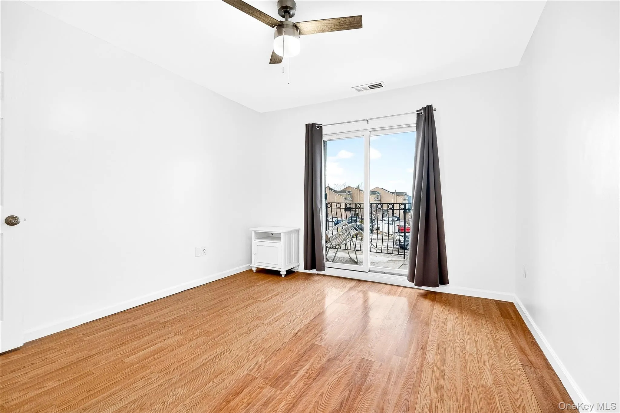 second bedroom balcony access overlooking parking area, some water view, courtyard. second bedroom balcony access overlooking parking area, some water view, courtyard.