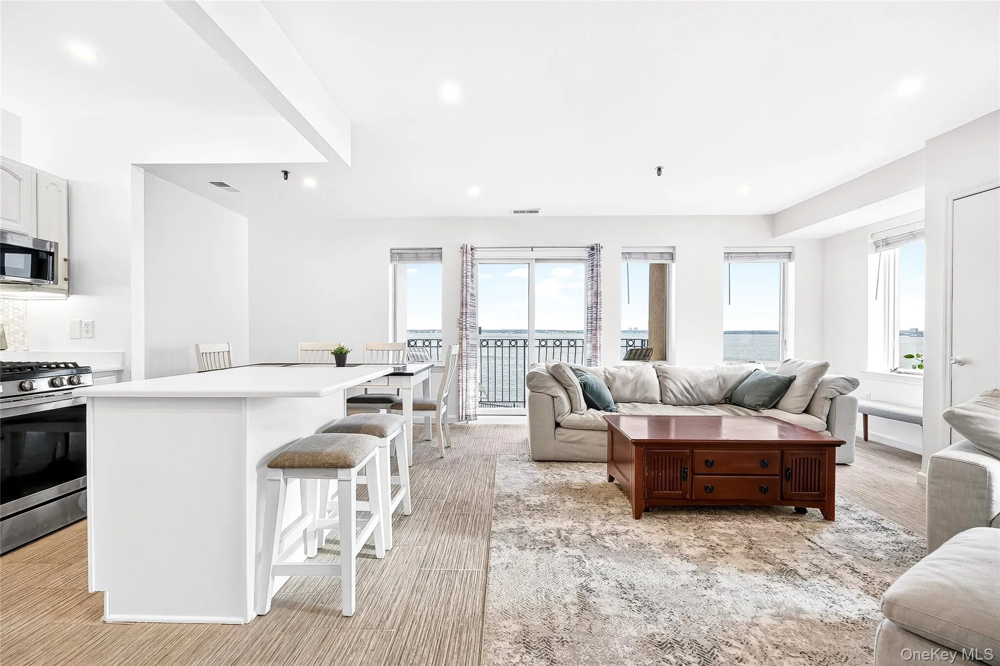 Open concept: living area dining area, breakfast bar island Open concept: living area dining area, breakfast bar island