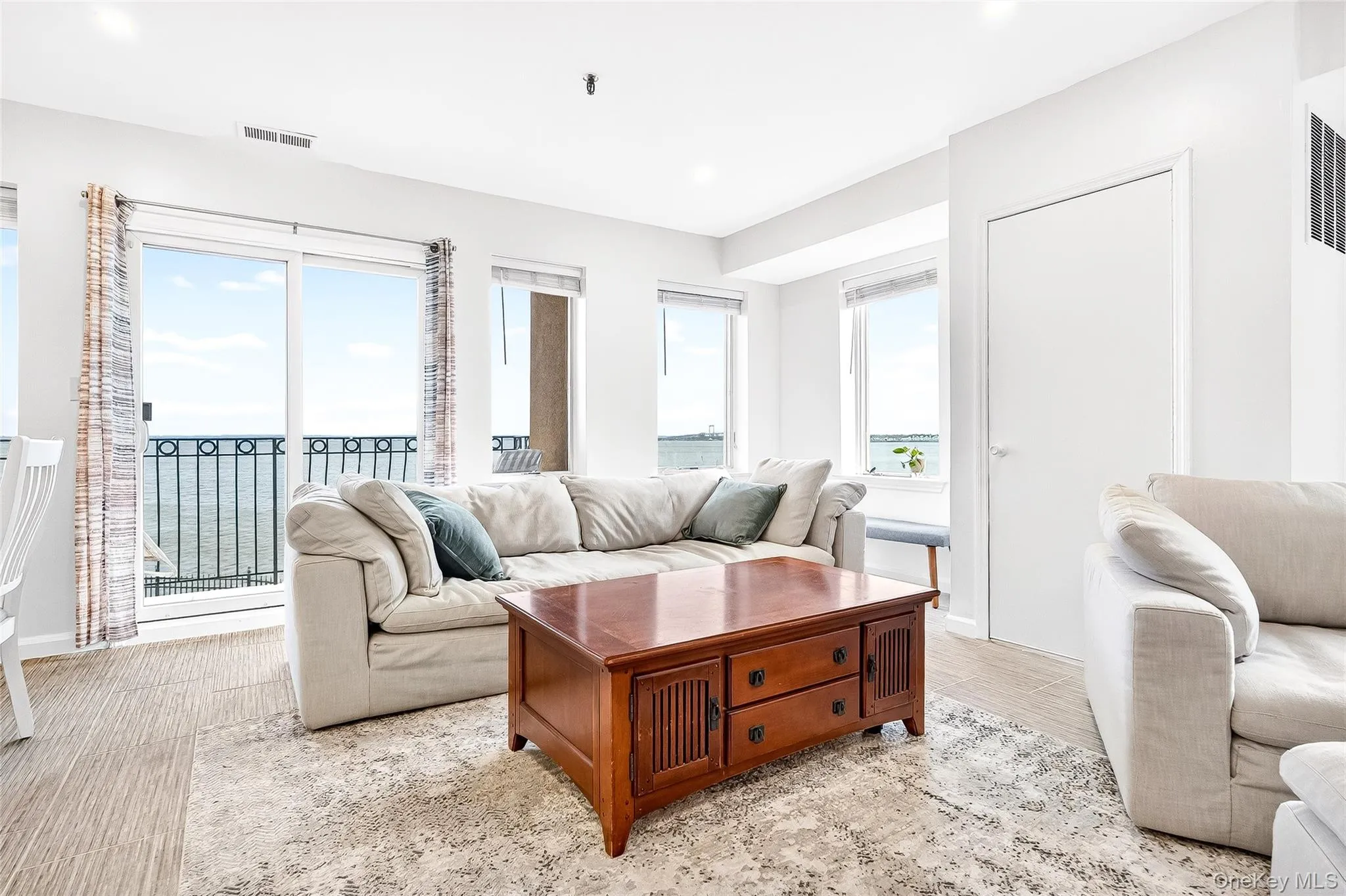 Living area water views access to rear balcony. Living area water views access to rear balcony.