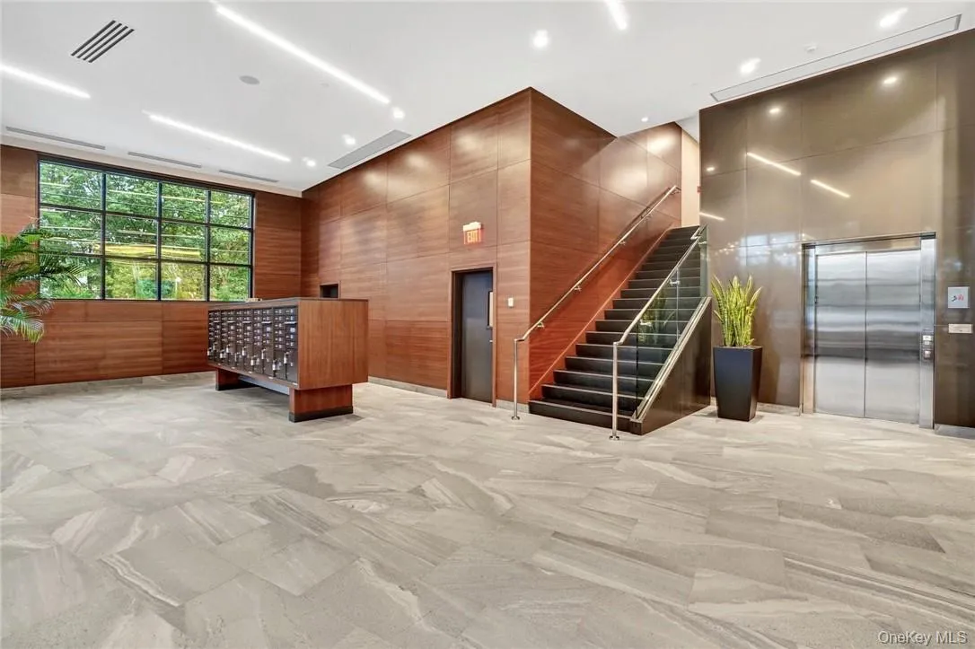 Welcoming large lobby featuring secure mail and package delivery Welcoming large lobby featuring secure mail and package delivery