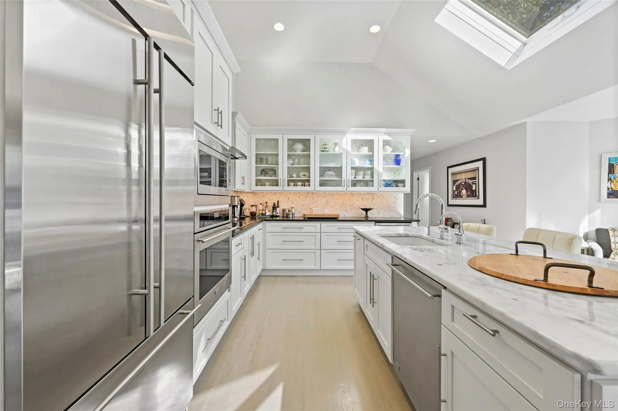 Kitchen with built in appliances, sink, and white cabinets Kitchen with built in appliances, sink, and white cabinets