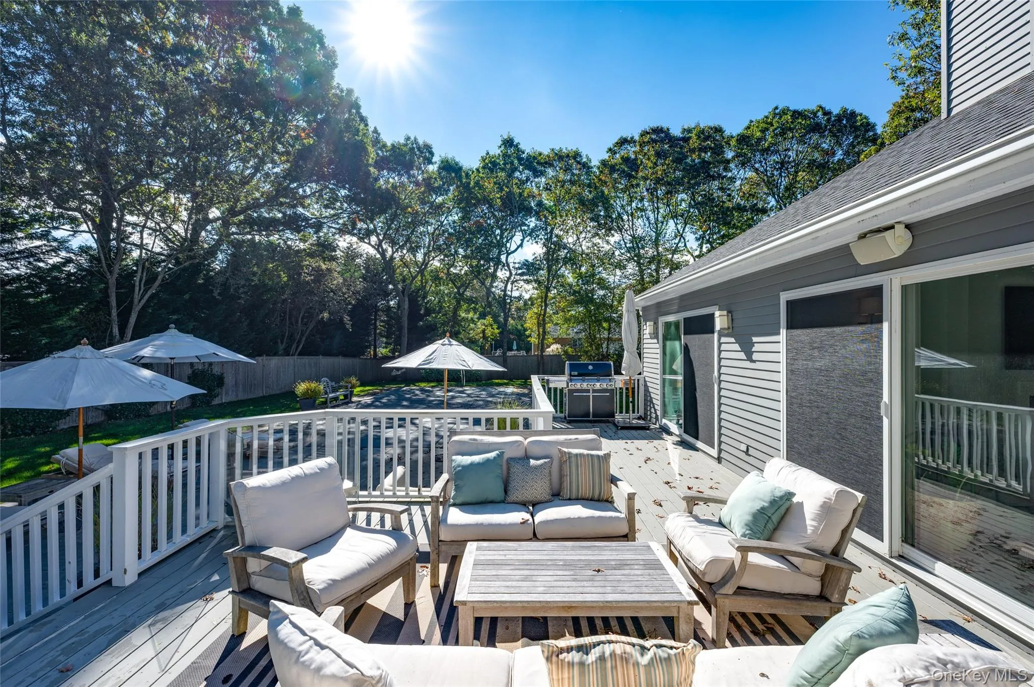 Wooden terrace featuring an outdoor hangout area Wooden terrace featuring an outdoor hangout area