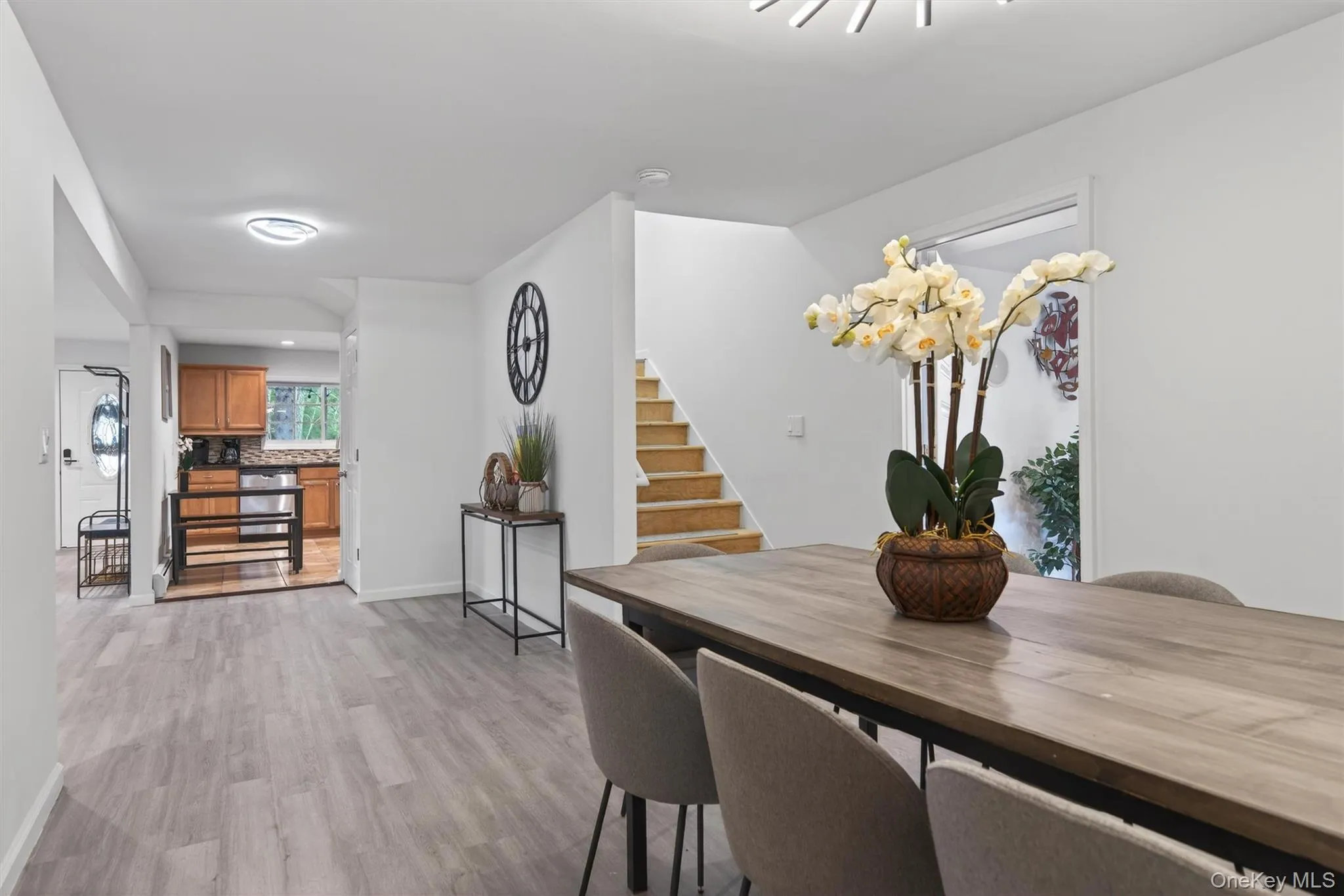 View to kitchen, stair up to bedrooms, living room to right View to kitchen, stair up to bedrooms, living room to right