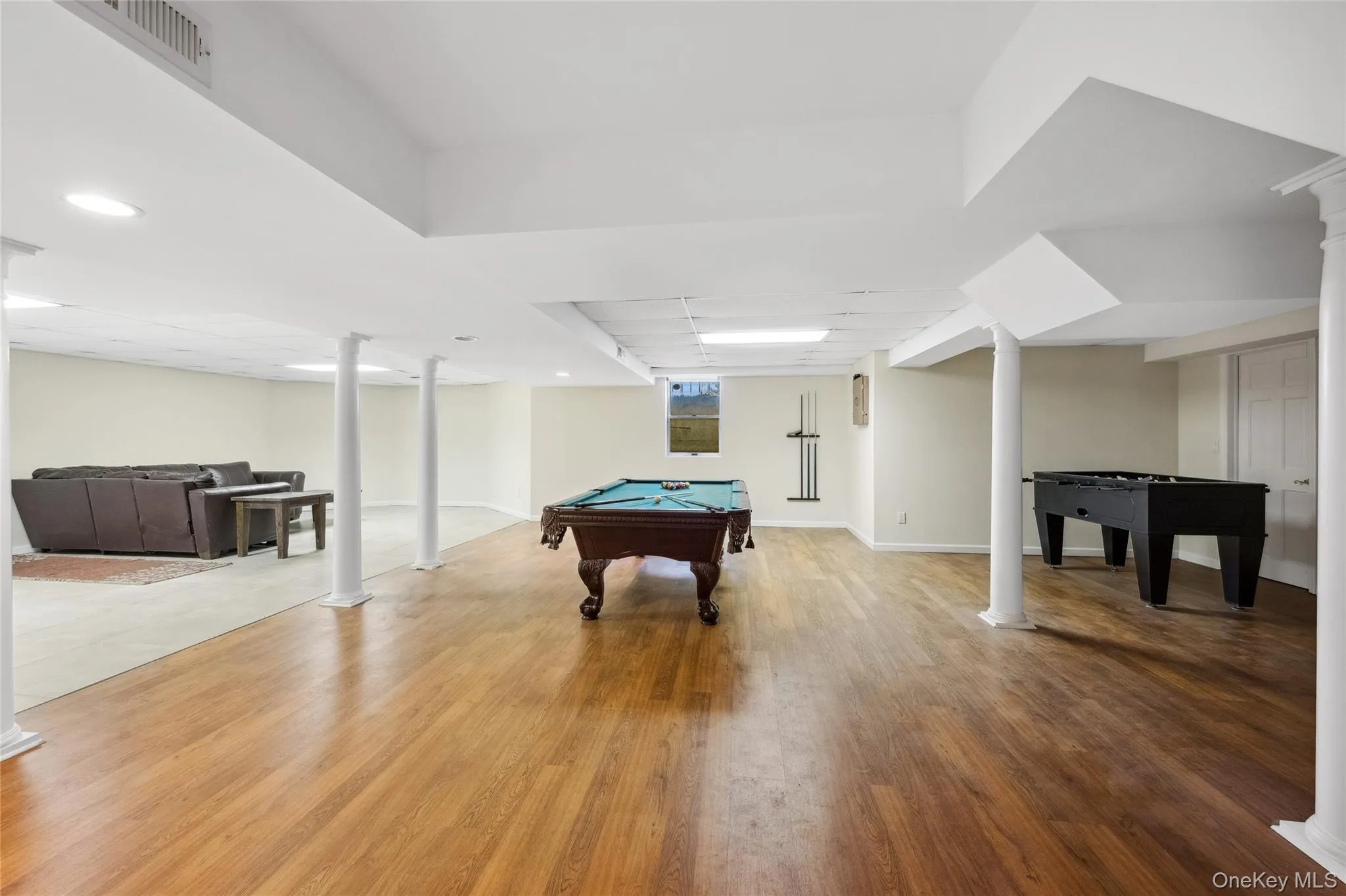 Recreation room with light wood-type flooring, decorative columns, visible vents, recessed lighting, and billiards Recreation room with light wood-type flooring, decorative columns, visible vents, recessed lighting, and billiards